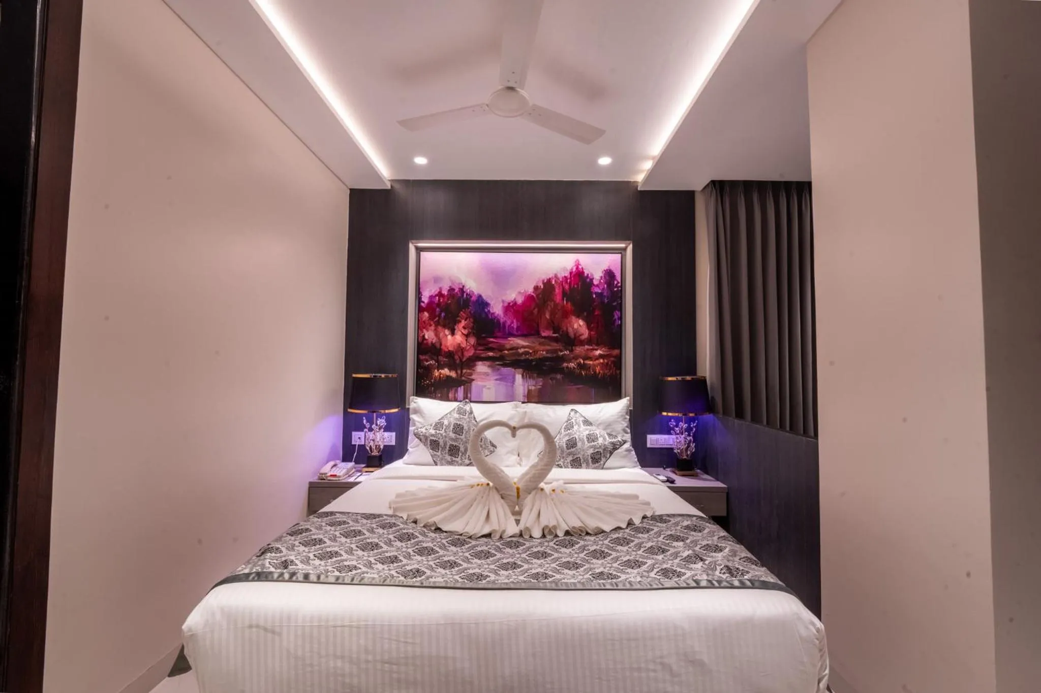 Bed in Ramee Tarang Hotel Indore