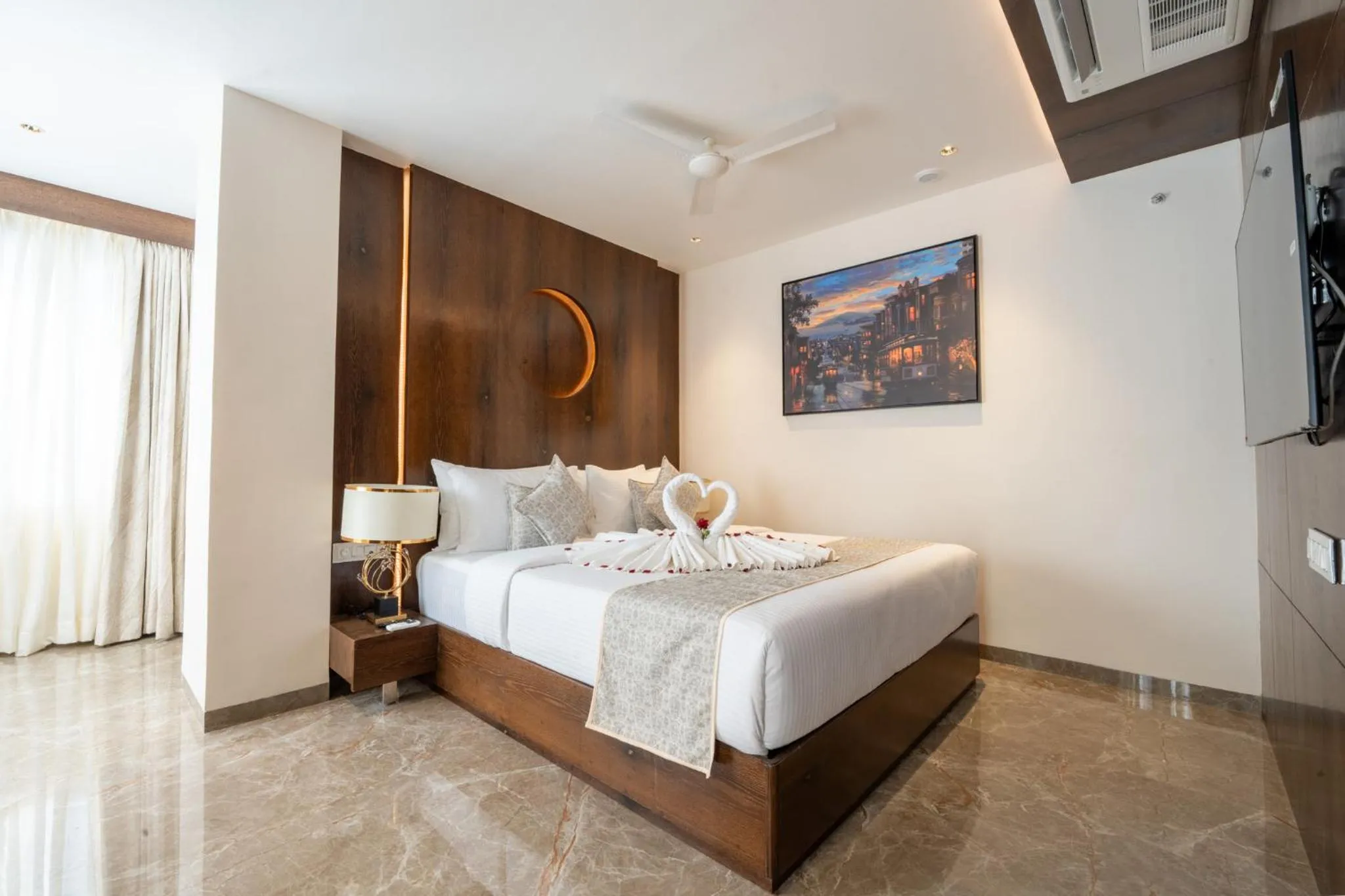 Bed in Ramee Tarang Hotel Indore