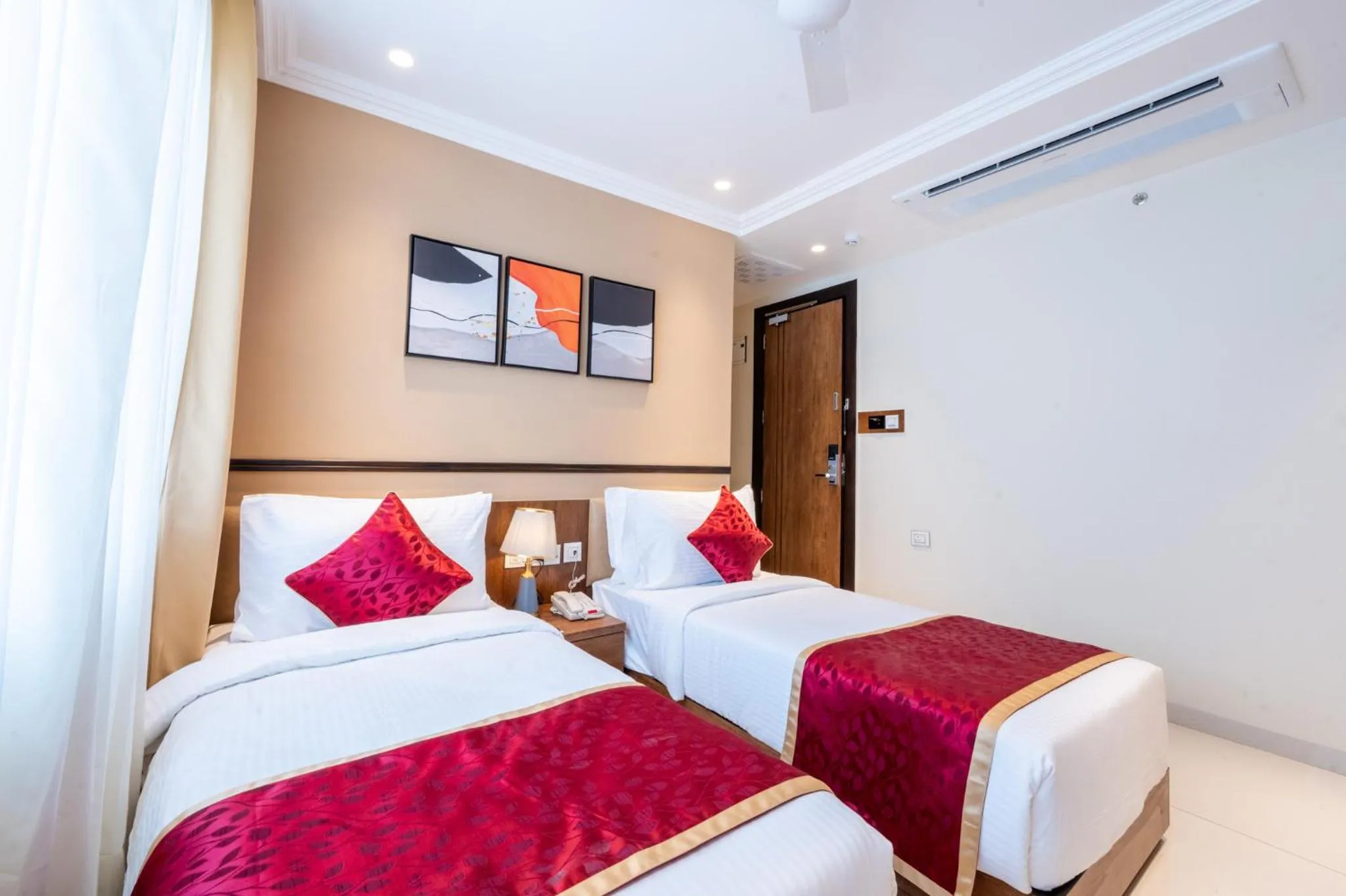 Bed in Ramee Tarang Hotel Indore