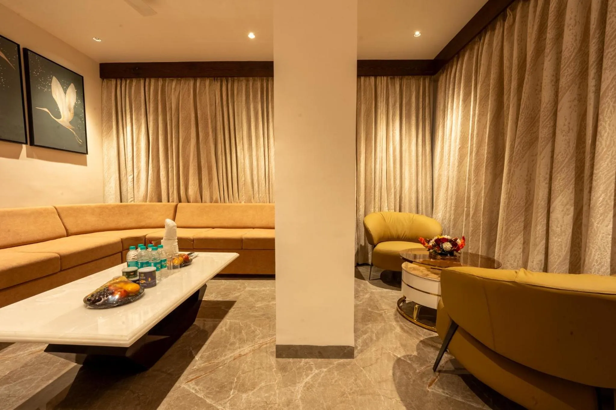 Living room in Ramee Tarang Hotel Indore