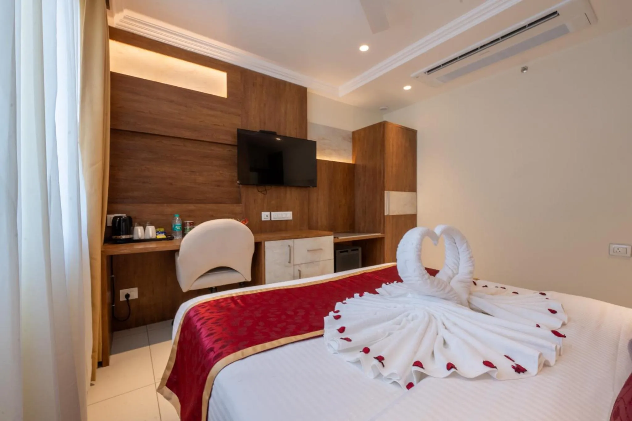 Bed in Ramee Tarang Hotel Indore