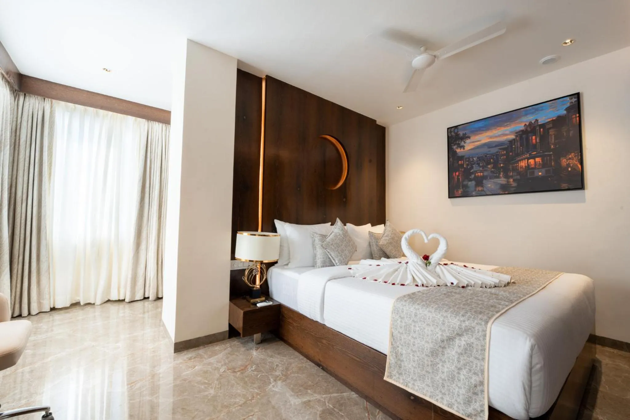 Bed in Ramee Tarang Hotel Indore