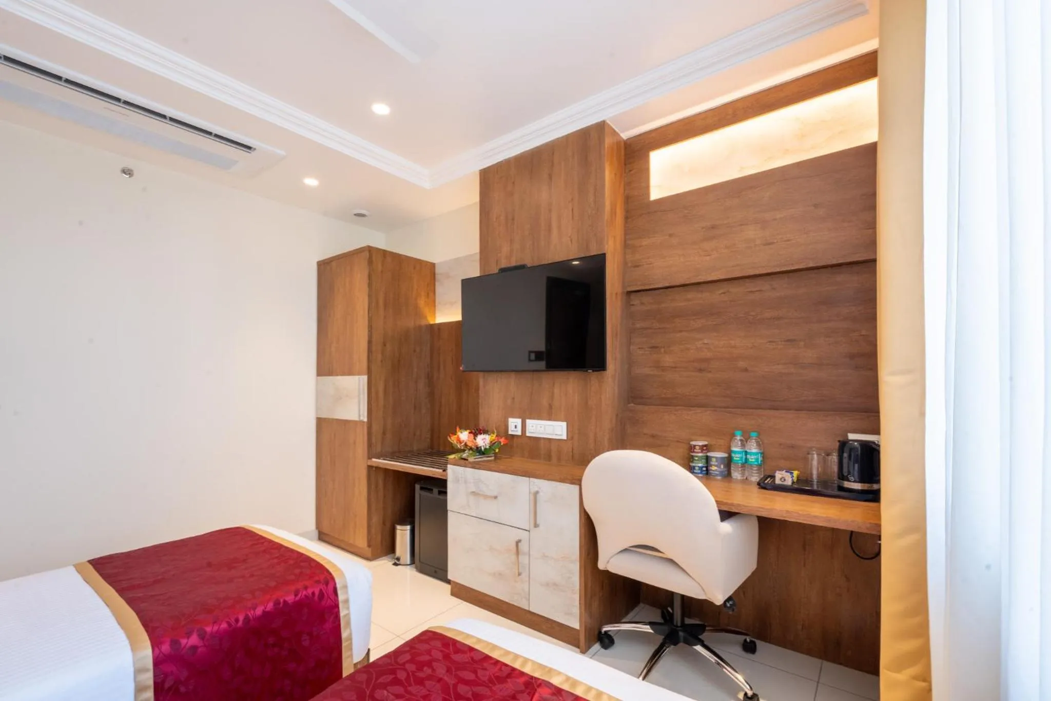 Bed in Ramee Tarang Hotel Indore