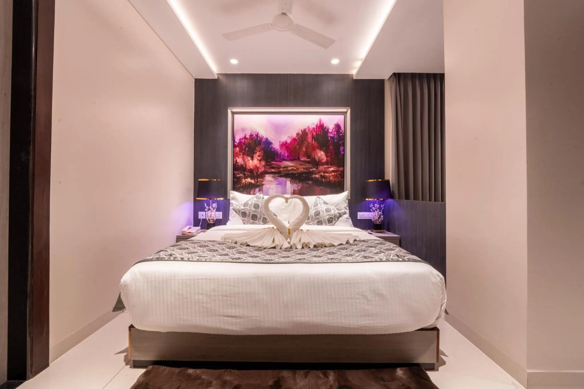 Bed in Ramee Tarang Hotel Indore