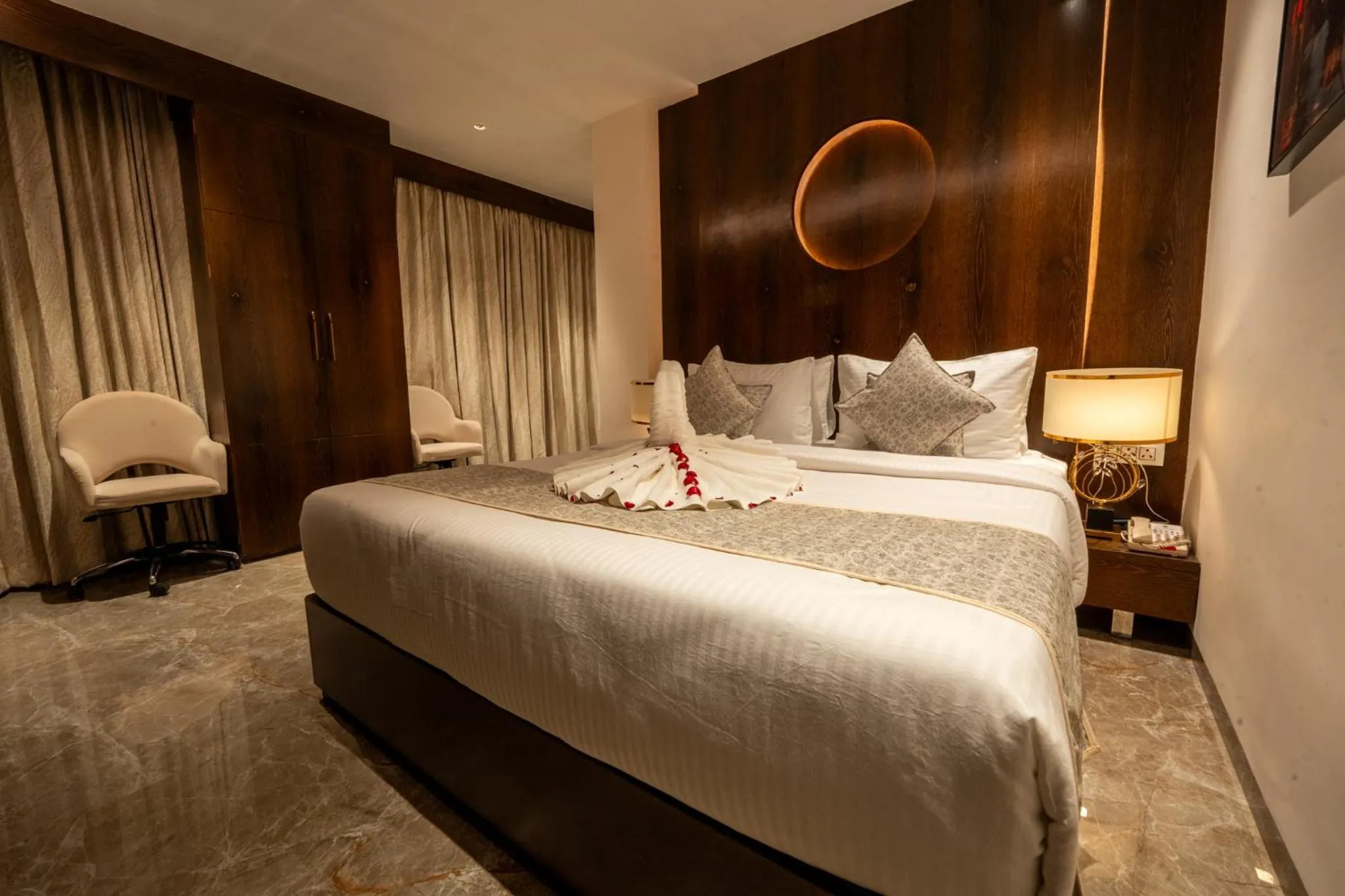 Bed in Ramee Tarang Hotel Indore