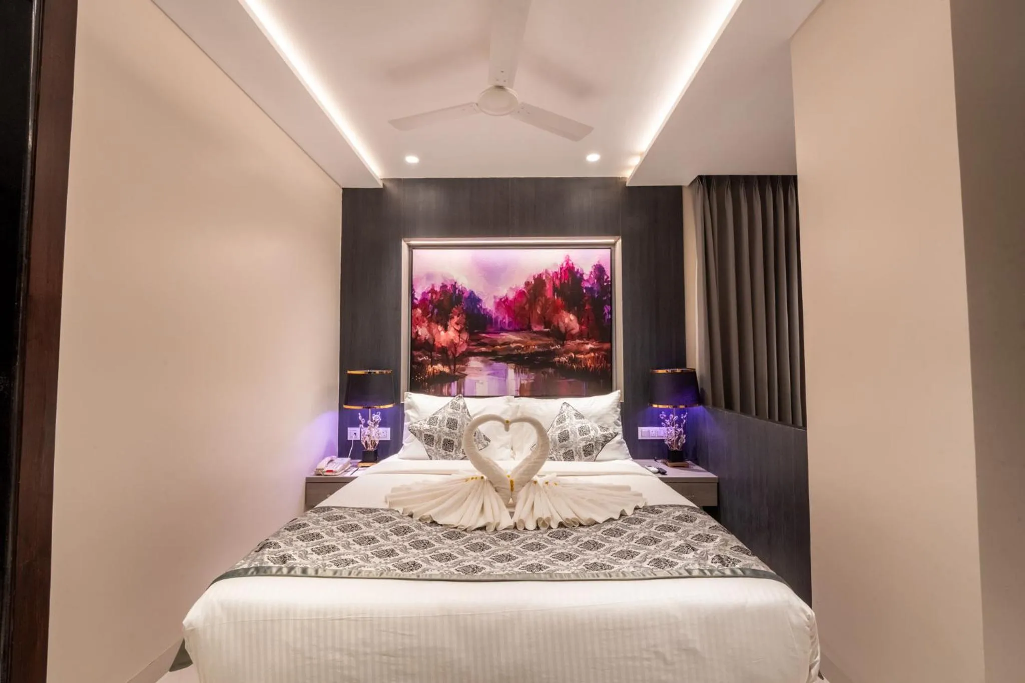 Bed in Ramee Tarang Hotel Indore
