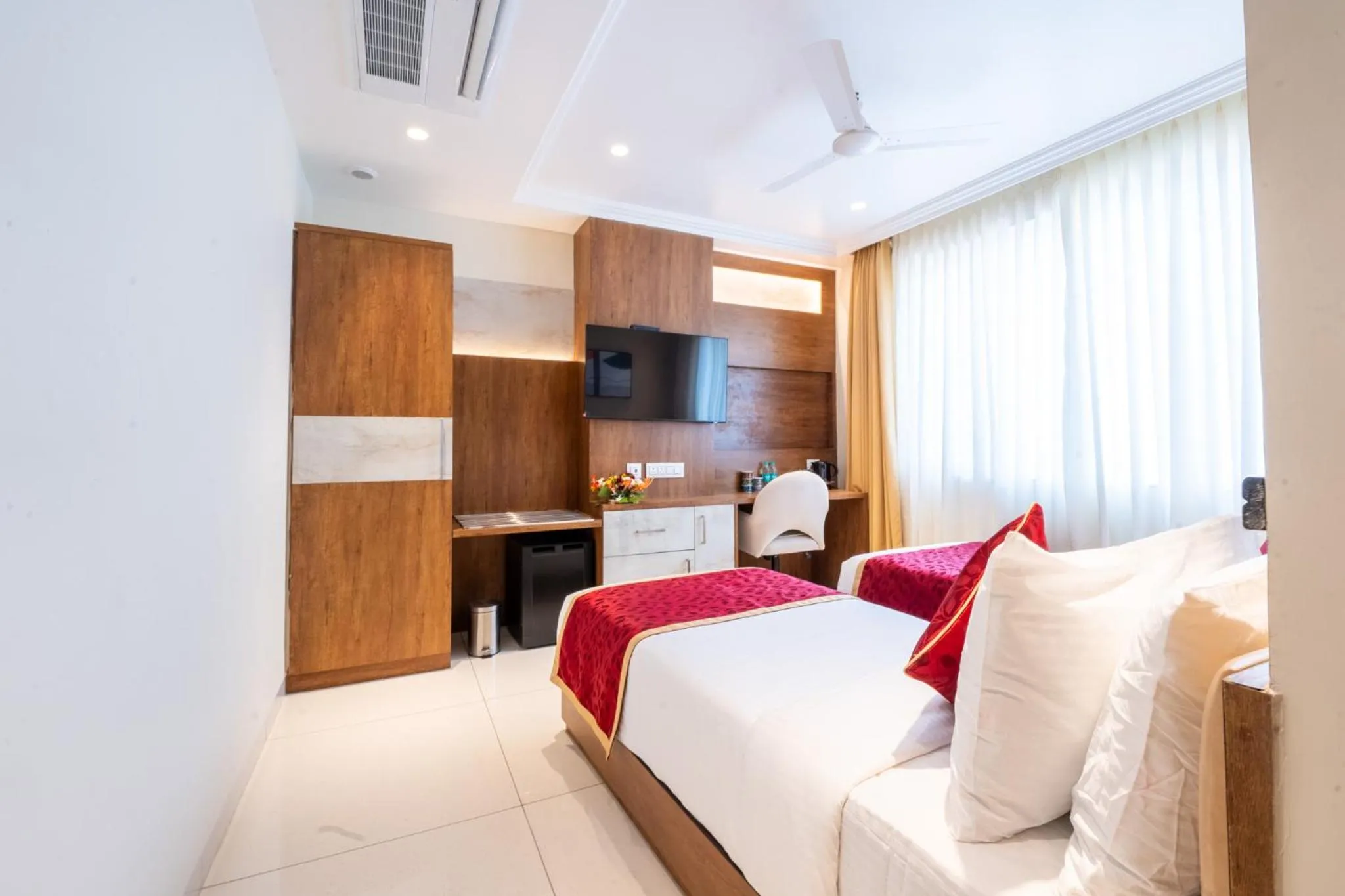 Bed in Ramee Tarang Hotel Indore