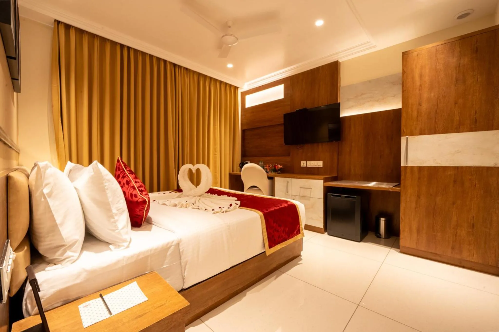 Bed in Ramee Tarang Hotel Indore