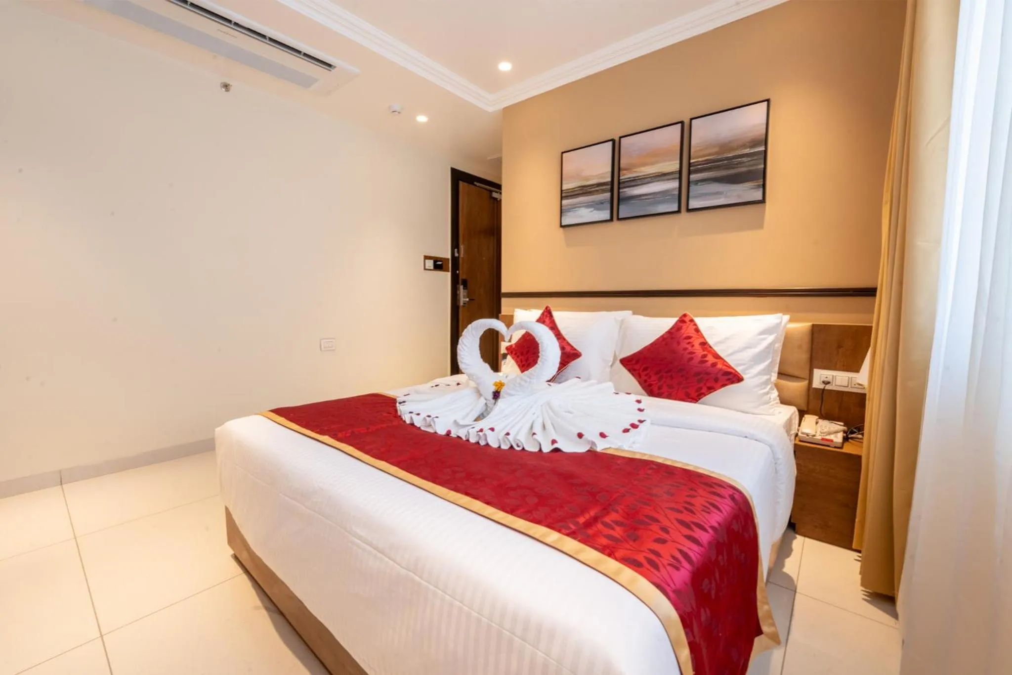 Bed in Ramee Tarang Hotel Indore