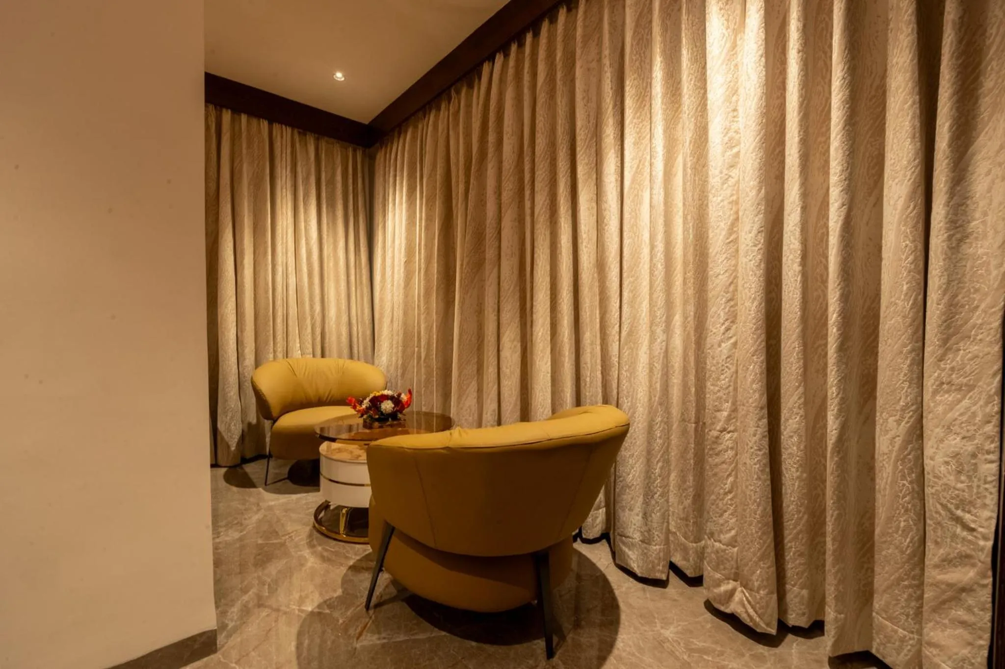Living room in Ramee Tarang Hotel Indore