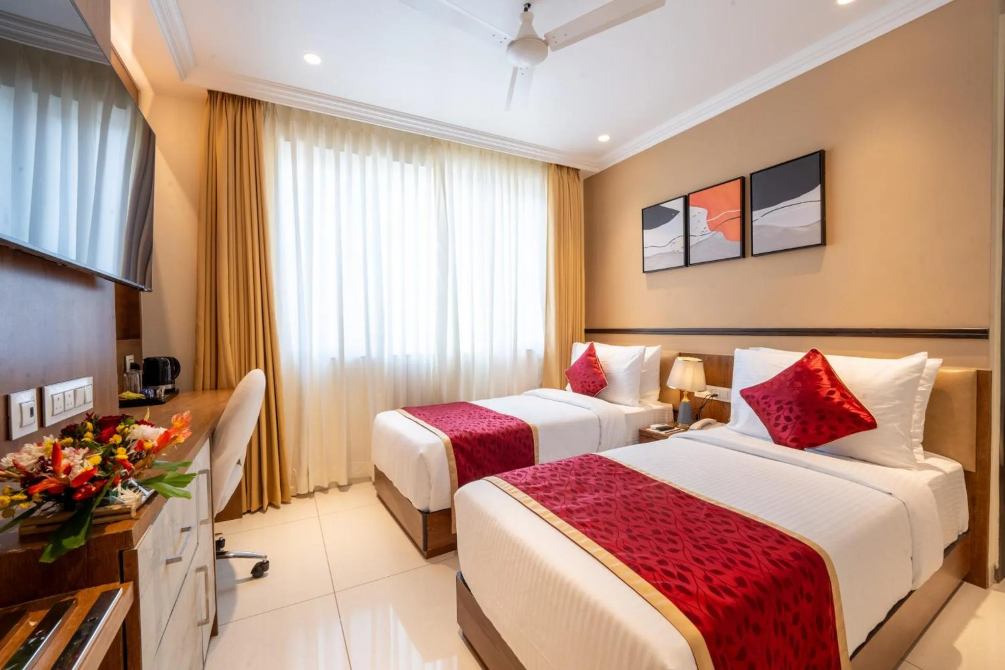 Bed in Ramee Tarang Hotel Indore