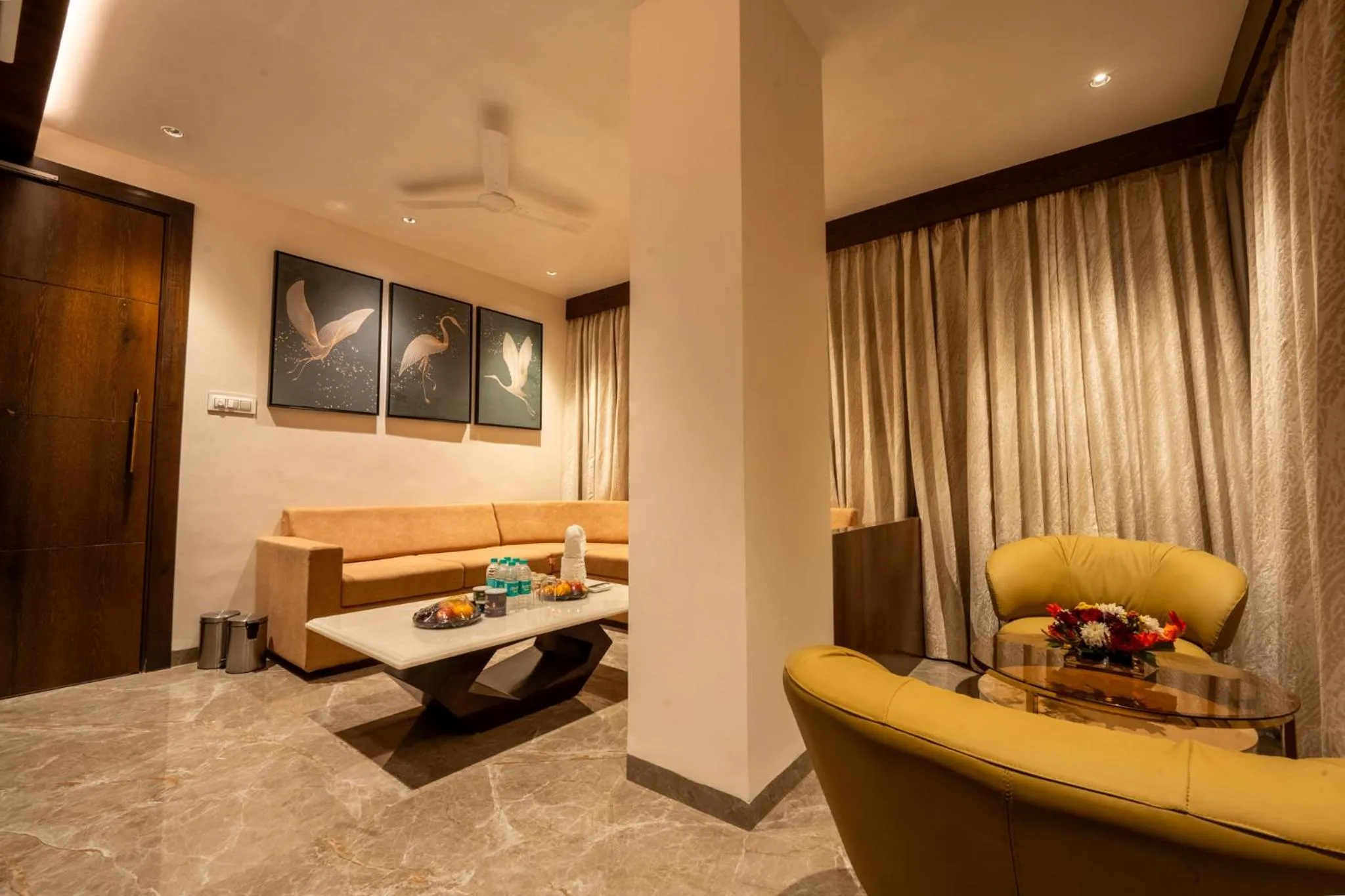 Living room in Ramee Tarang Hotel Indore