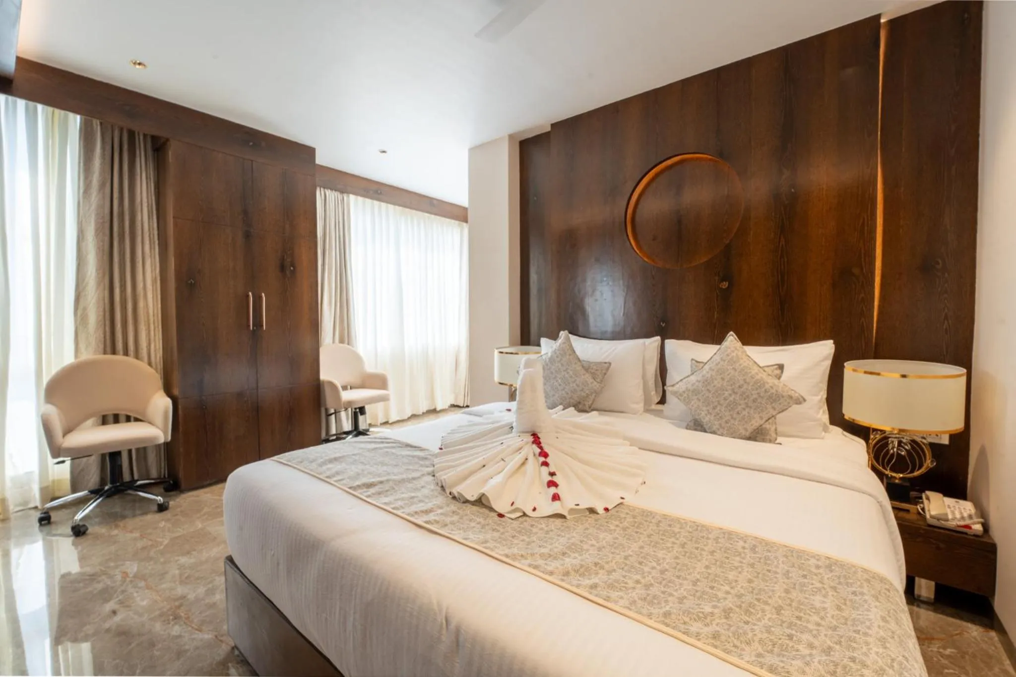 Bed in Ramee Tarang Hotel Indore