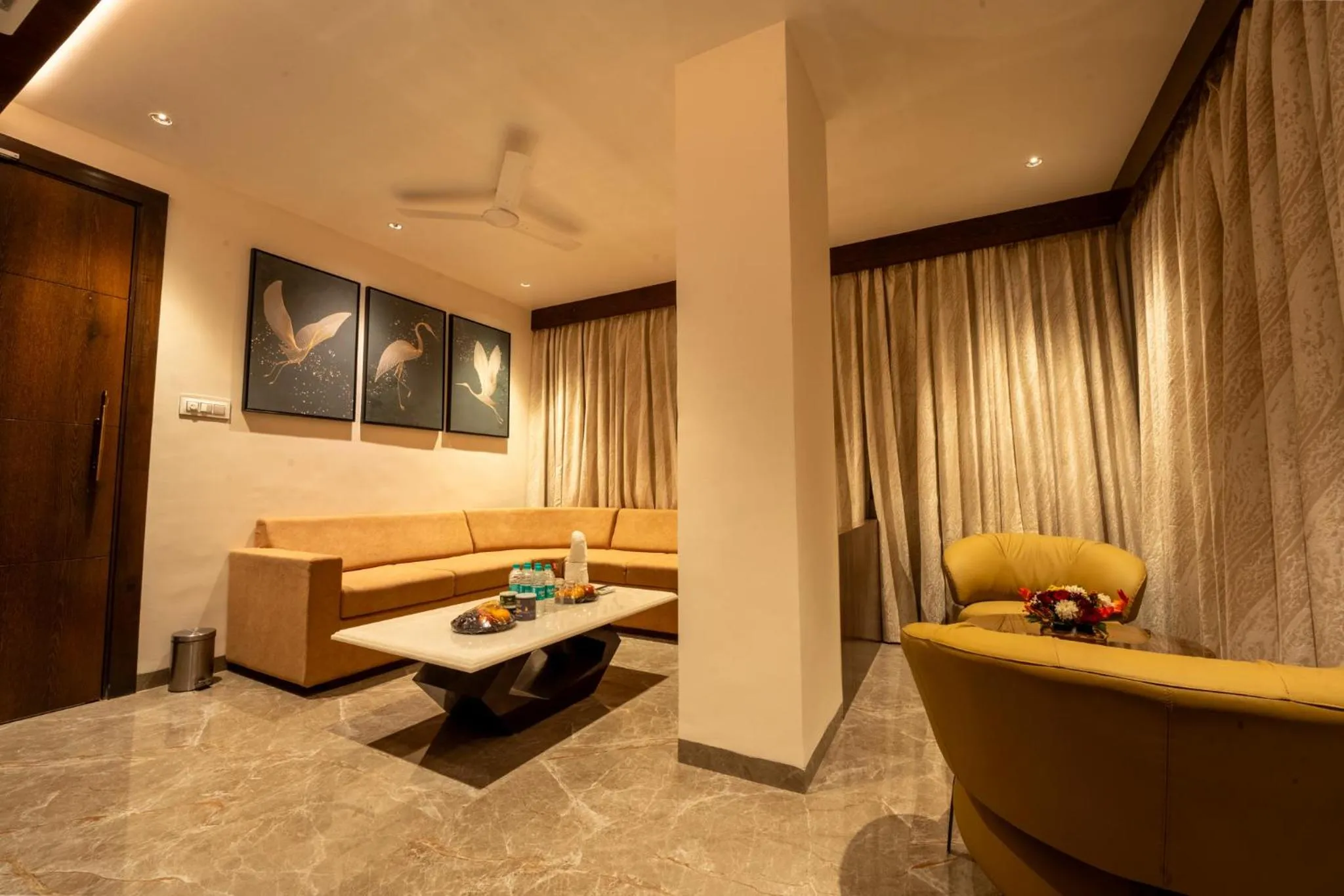Living room, Bed in Ramee Tarang Hotel Indore
