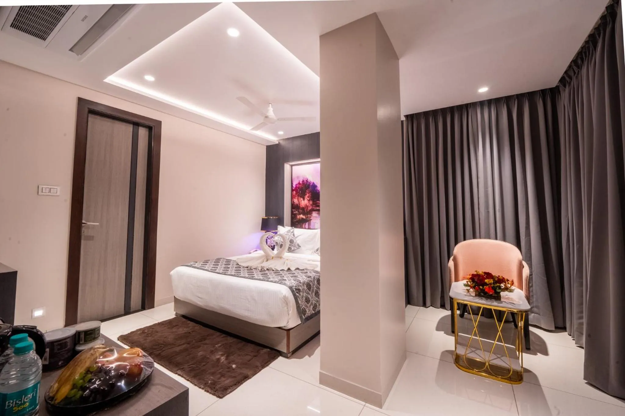 Bed in Ramee Tarang Hotel Indore
