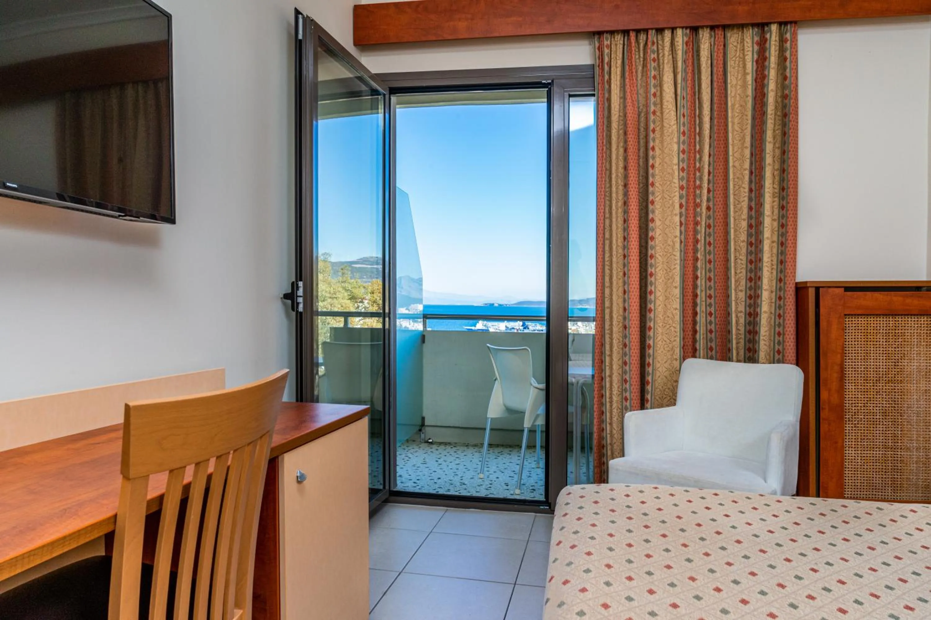 Bed in Marmari Bay Hotel