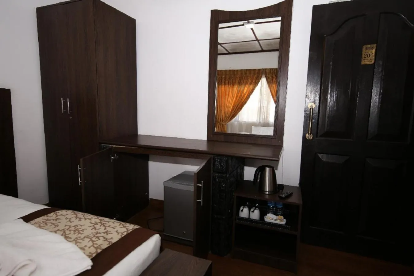 wardrobe, Bed in Nat City Hotel