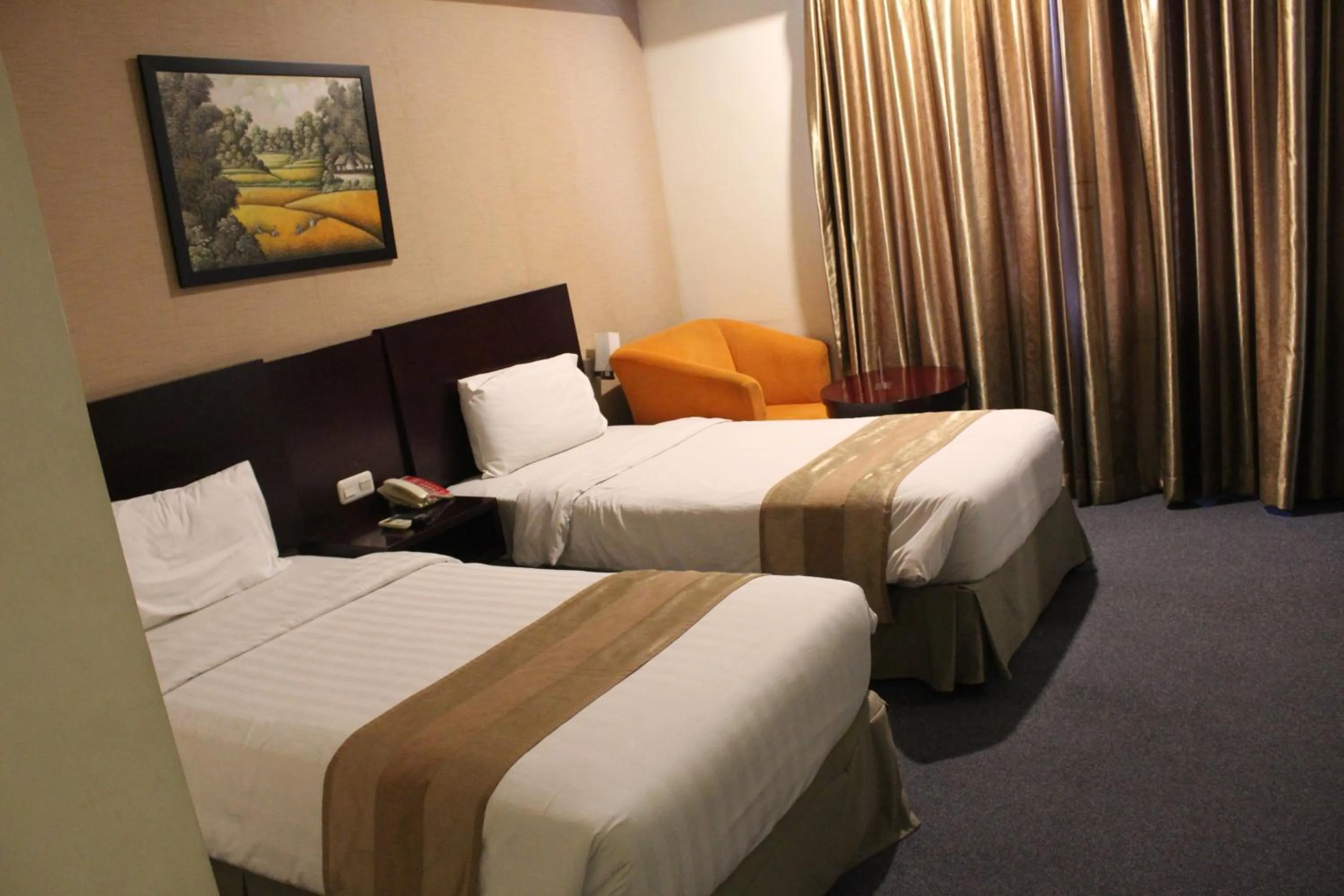Bed in Asialink Premier hotel