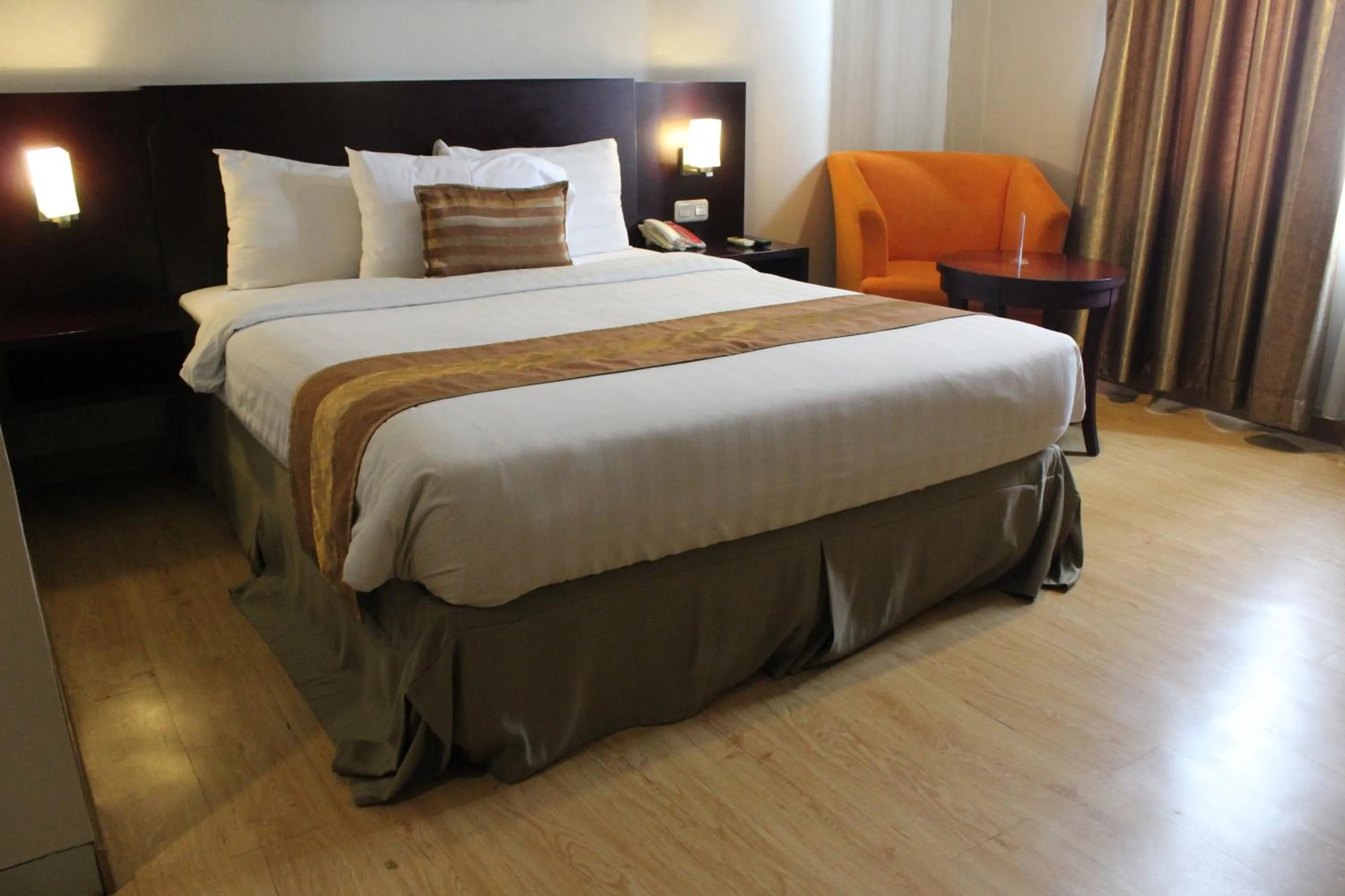 Bedroom in Asialink Premier hotel