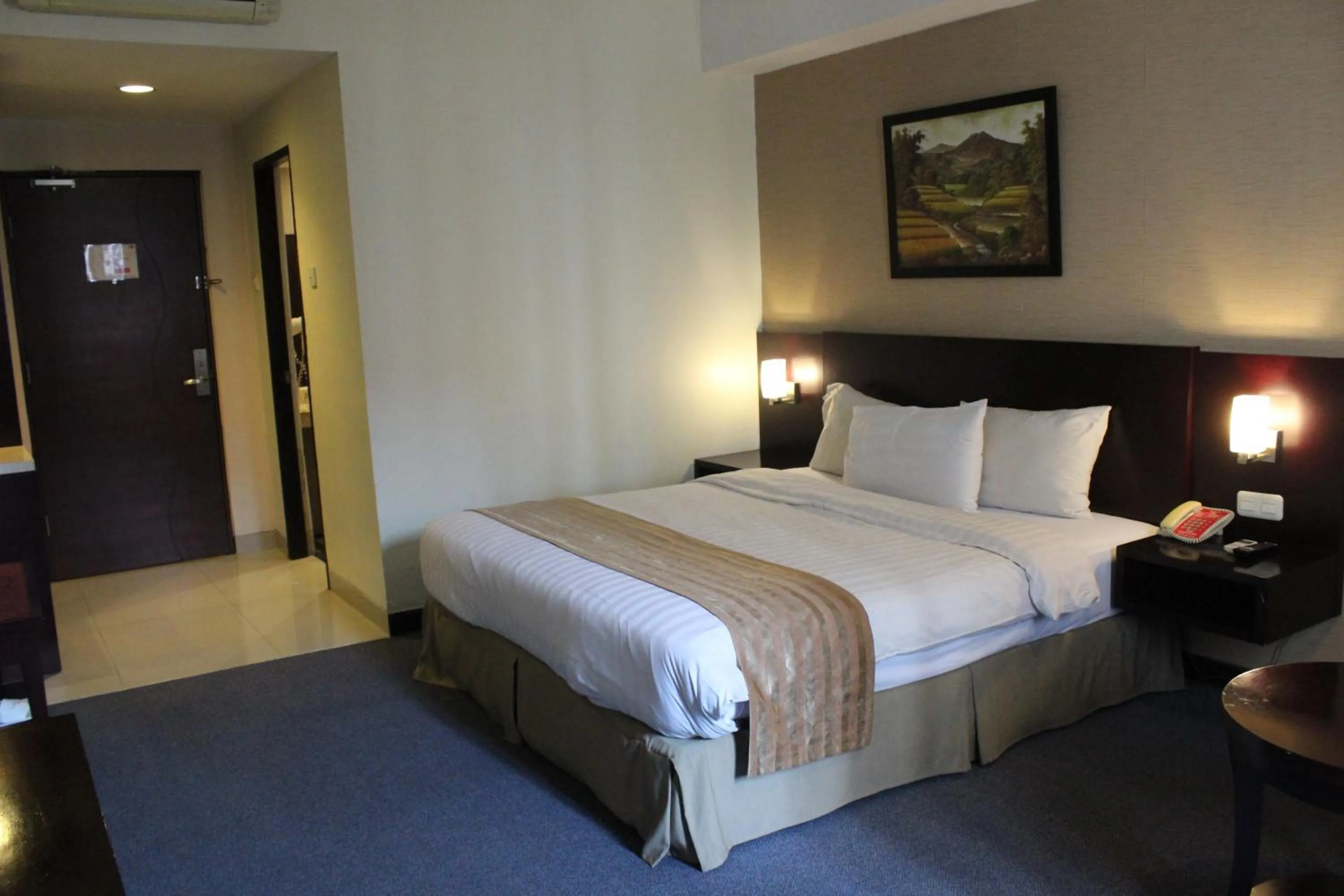 Bedroom in Asialink Premier hotel
