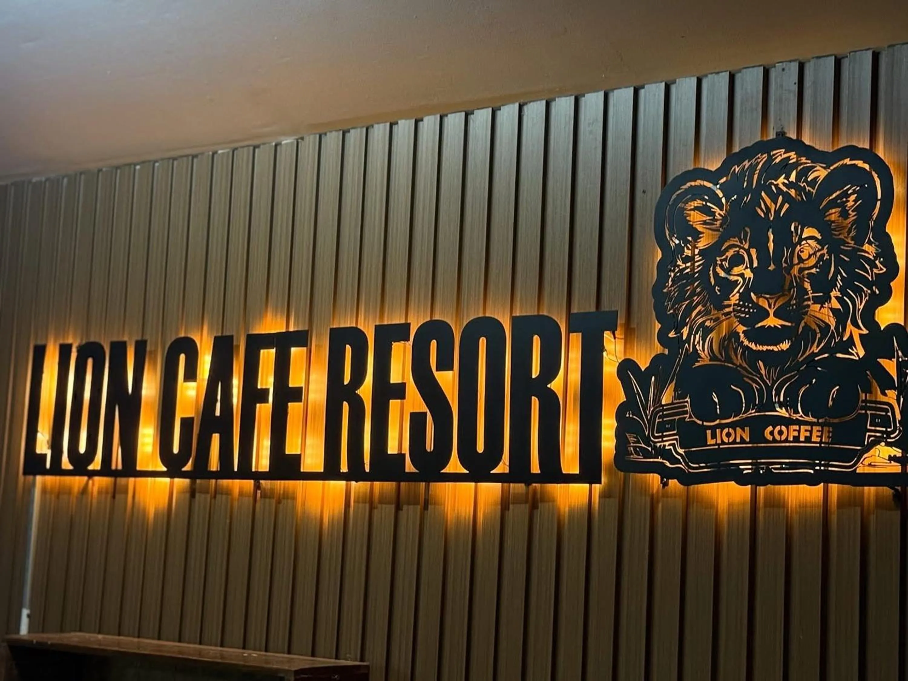 Property logo or sign in Lion Cafe Resort