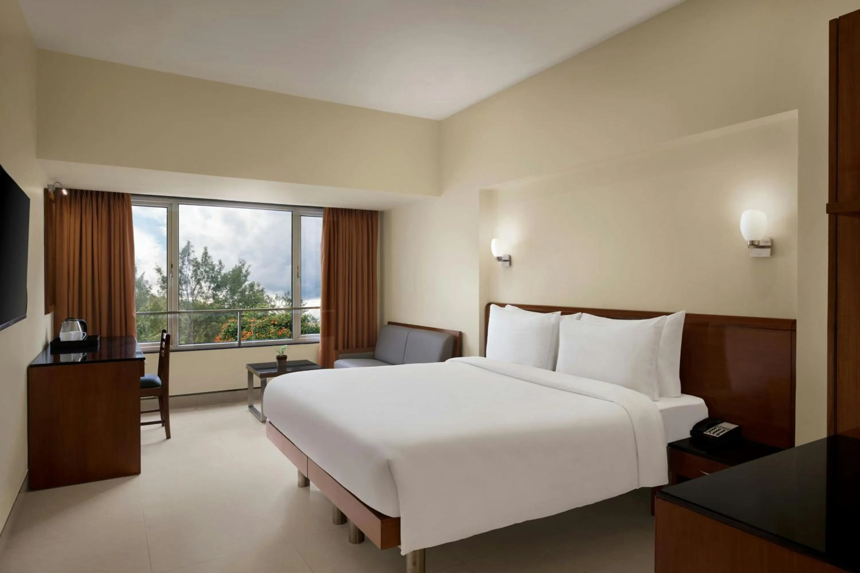 Photo of the whole room, Bed in The Fern Residency Woodland, Pune, Series by Marriott