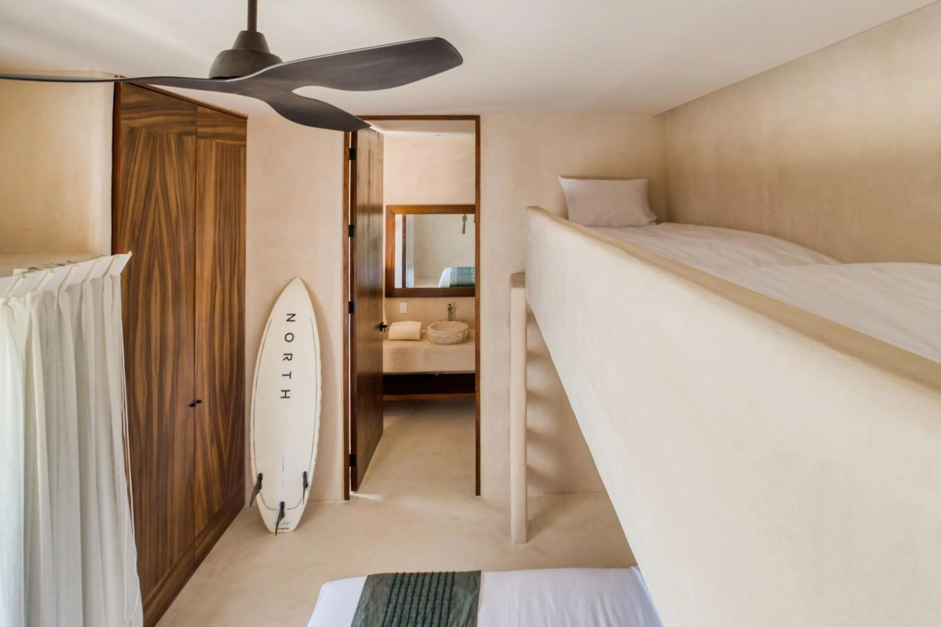 Bed in Amina Wind Resort by Tasman