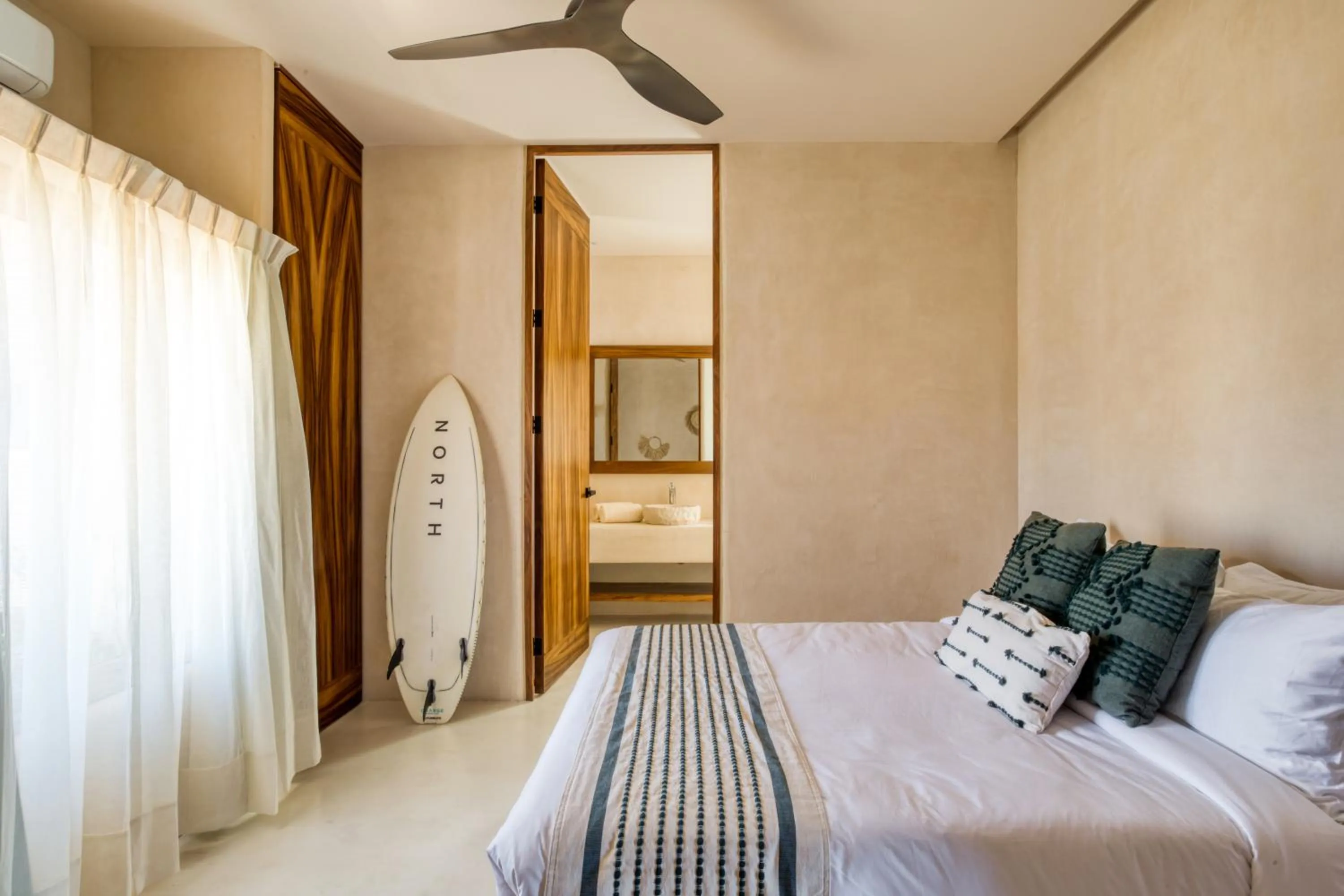 Bed in Amina Wind Resort by Tasman