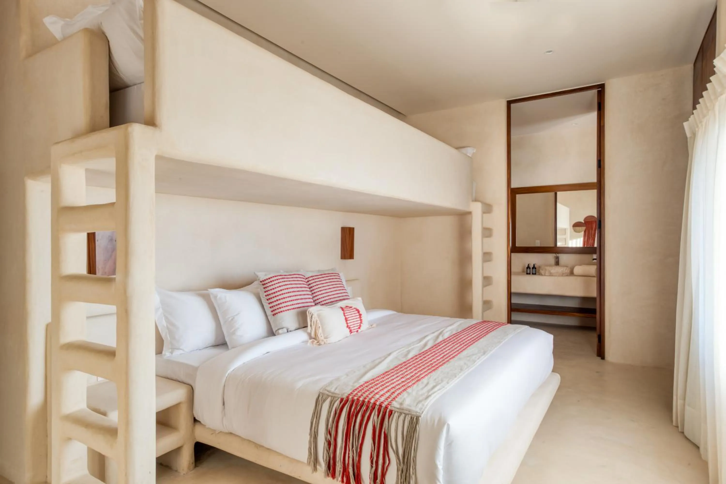 Bed in Amina Wind Resort by Tasman