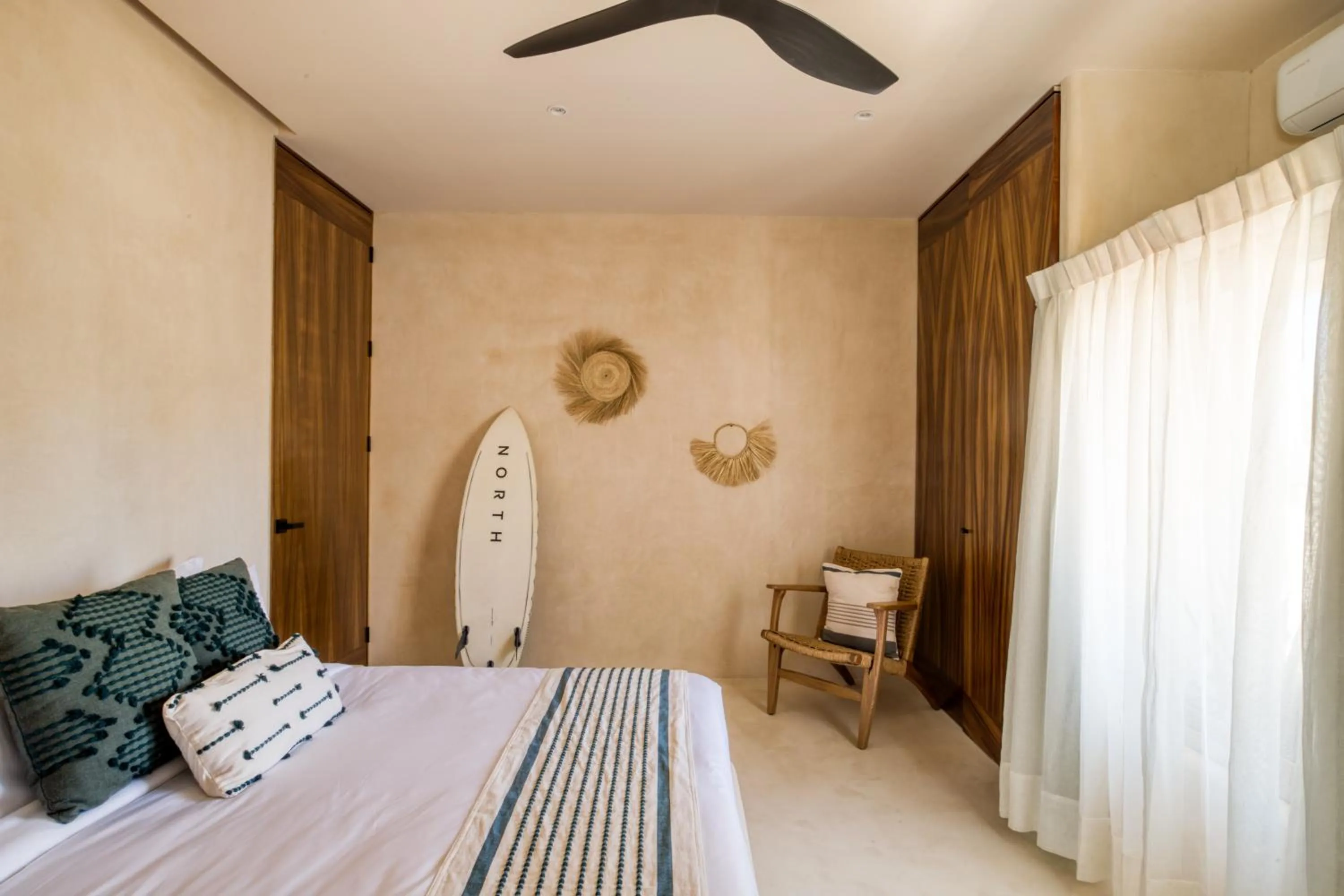 Bed in Amina Wind Resort by Tasman