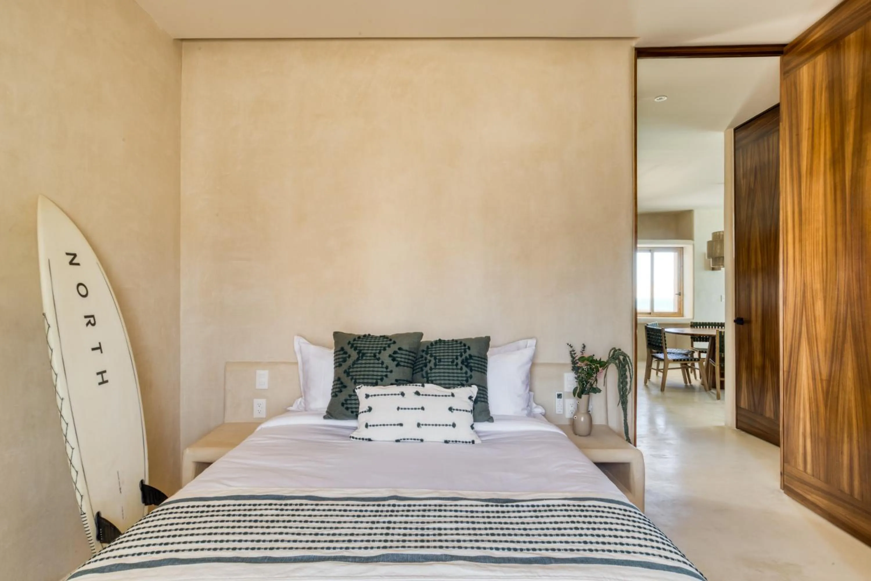 Bed in Amina Wind Resort by Tasman