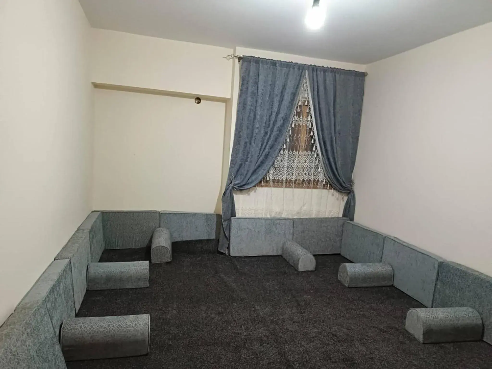 Seating area in Enjoying And Comfortable Stay Seating area in Enjoying And Comfortable Stay