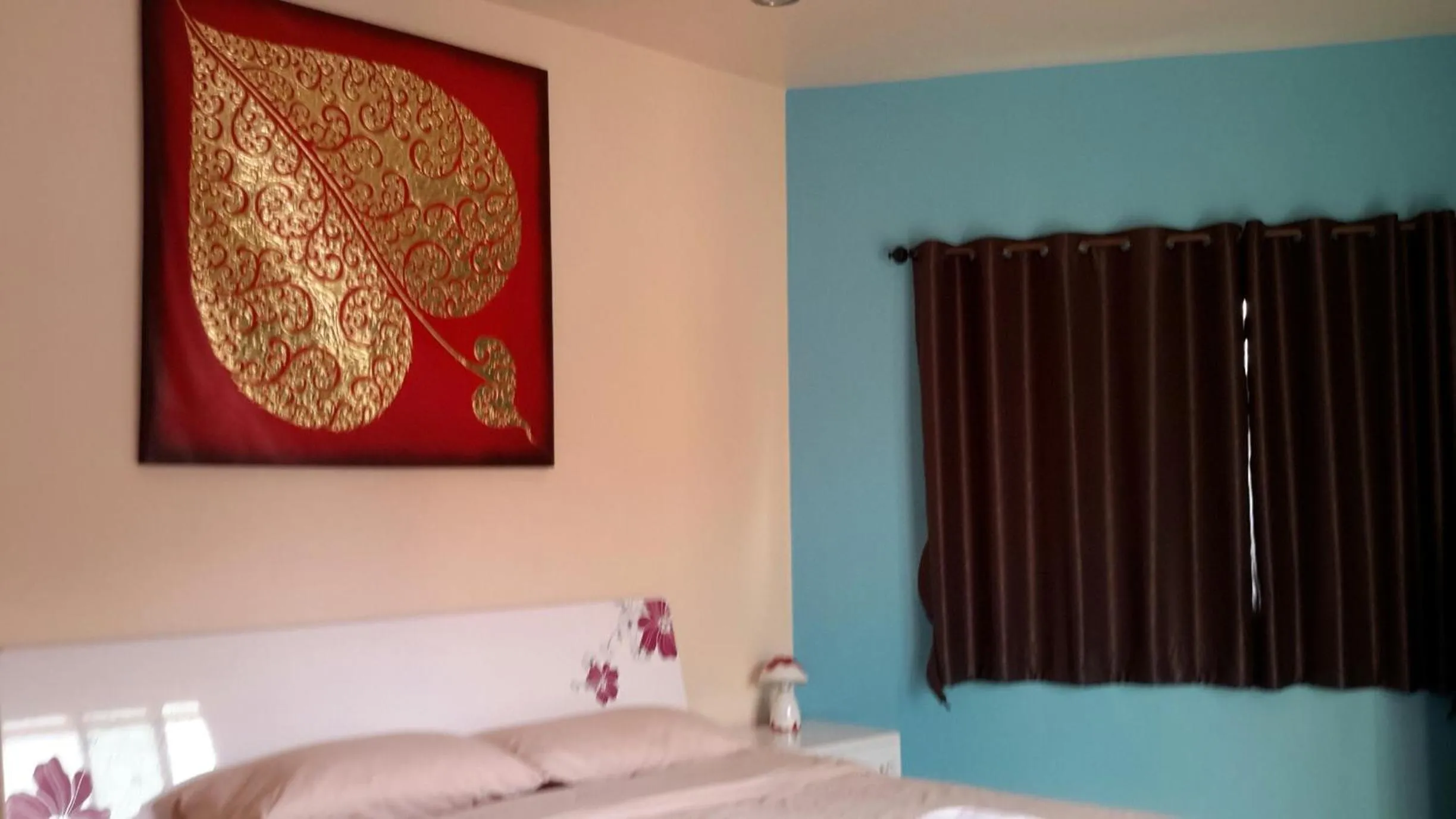 Bed in Donchai House Guest House& Cafe