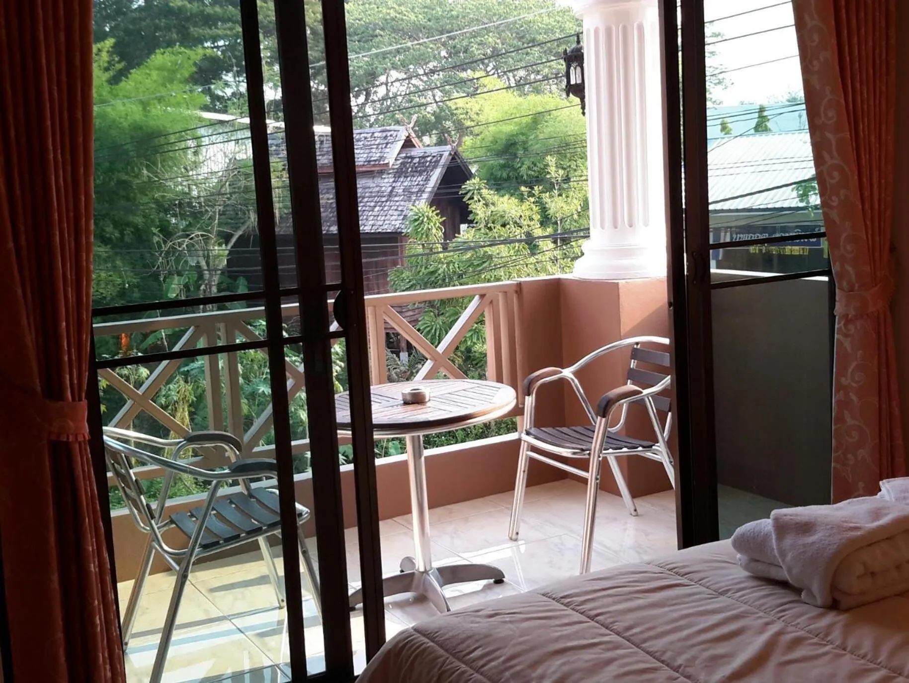 Bed in Donchai House Guest House& Cafe