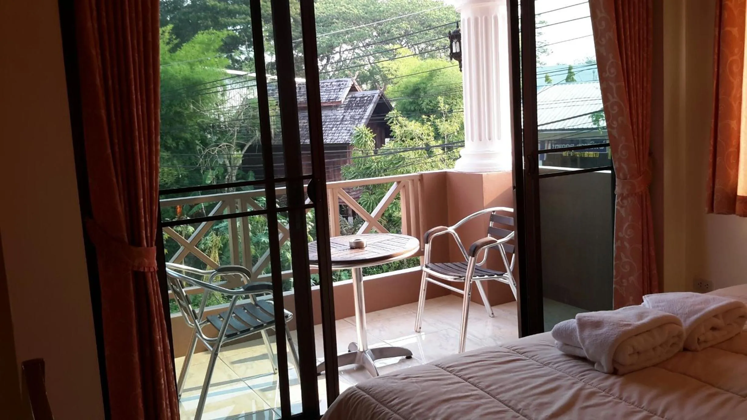 Bed in Donchai House Guest House& Cafe