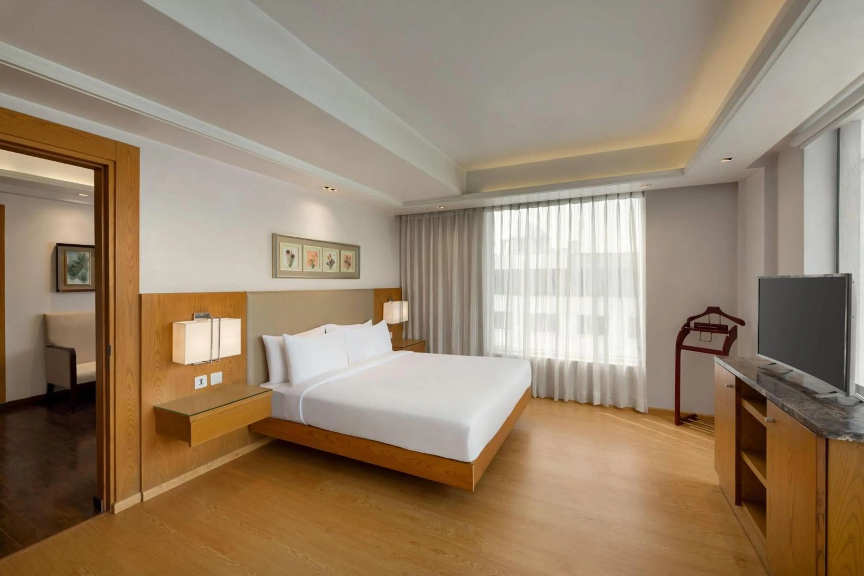Photo of the whole room, Bed in Ramada by Wyndham Ghaziabad Vasundhara