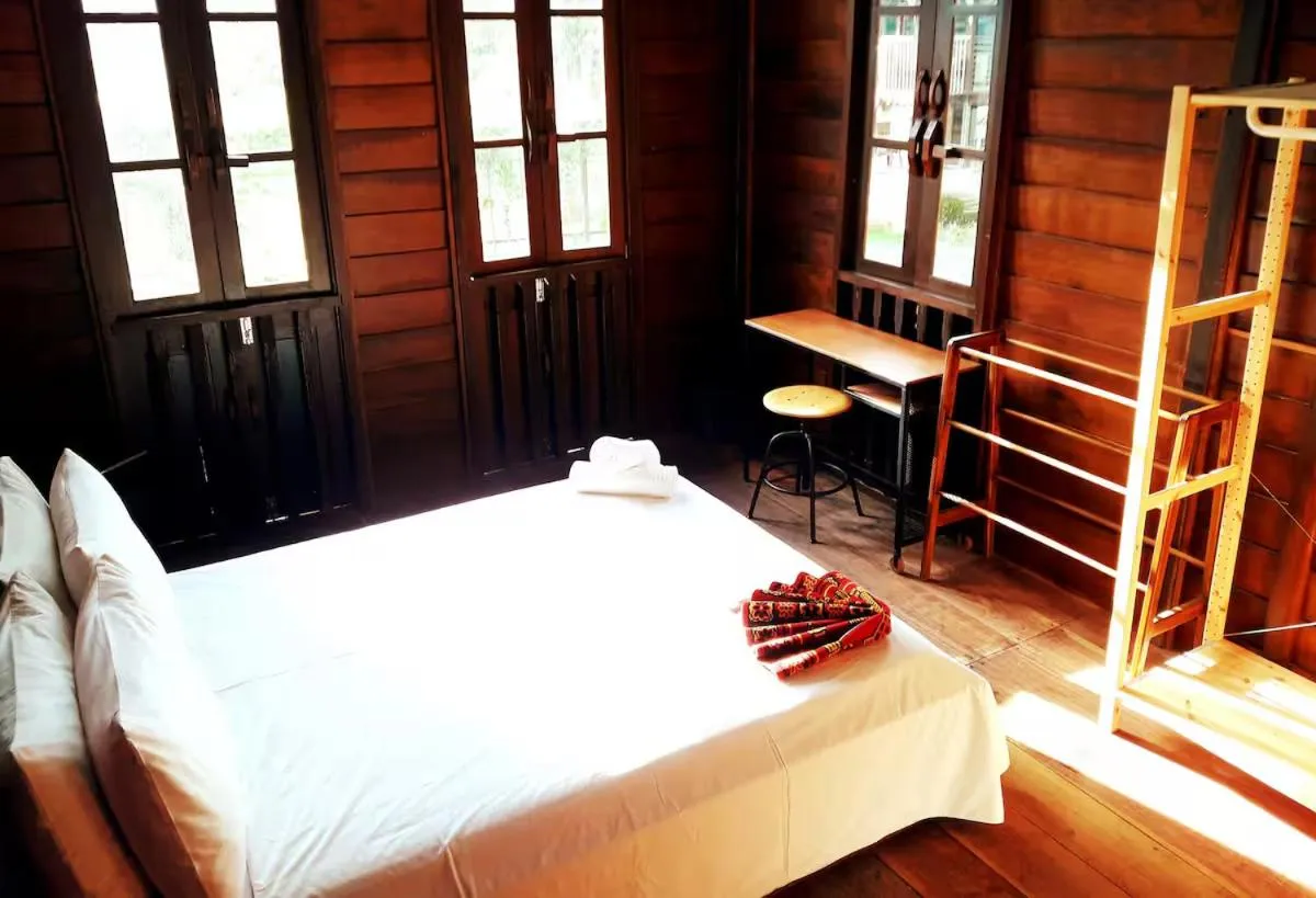 Bed in Bagas Zakariah Orchard Lodge