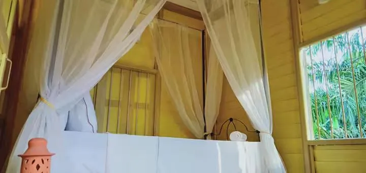 Bed in Bagas Zakariah Orchard Lodge