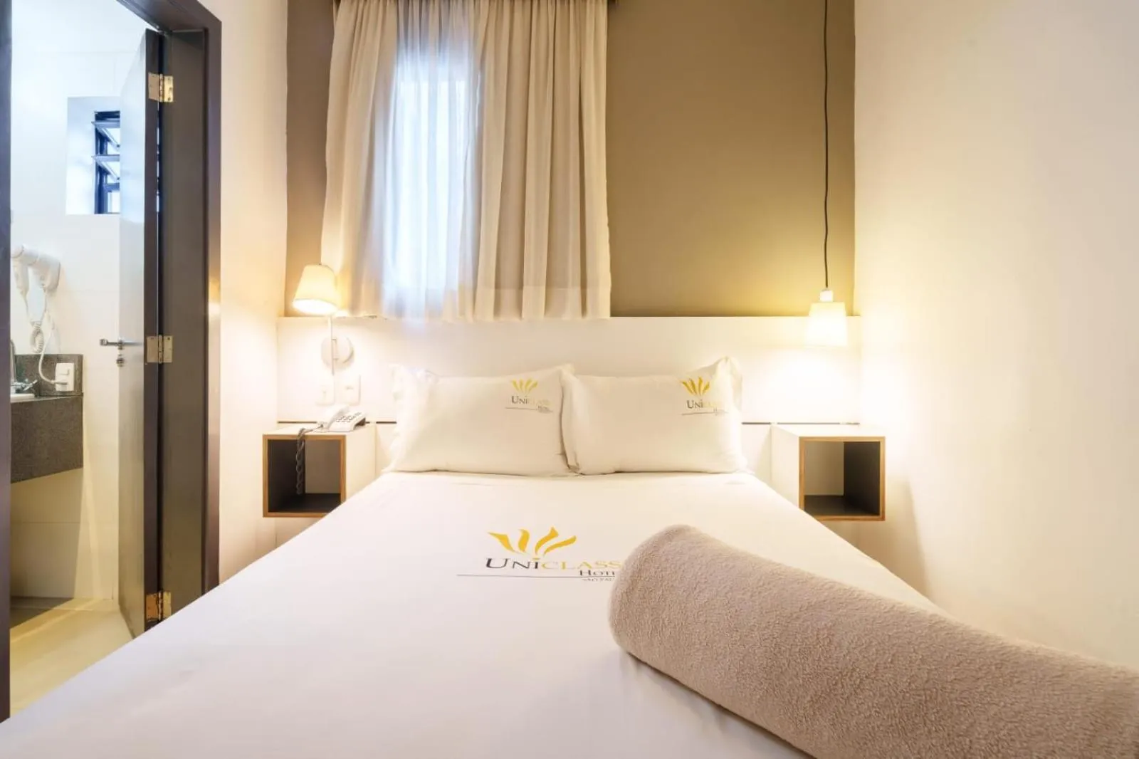 Bed in Uniclass Hotel Pinheiros