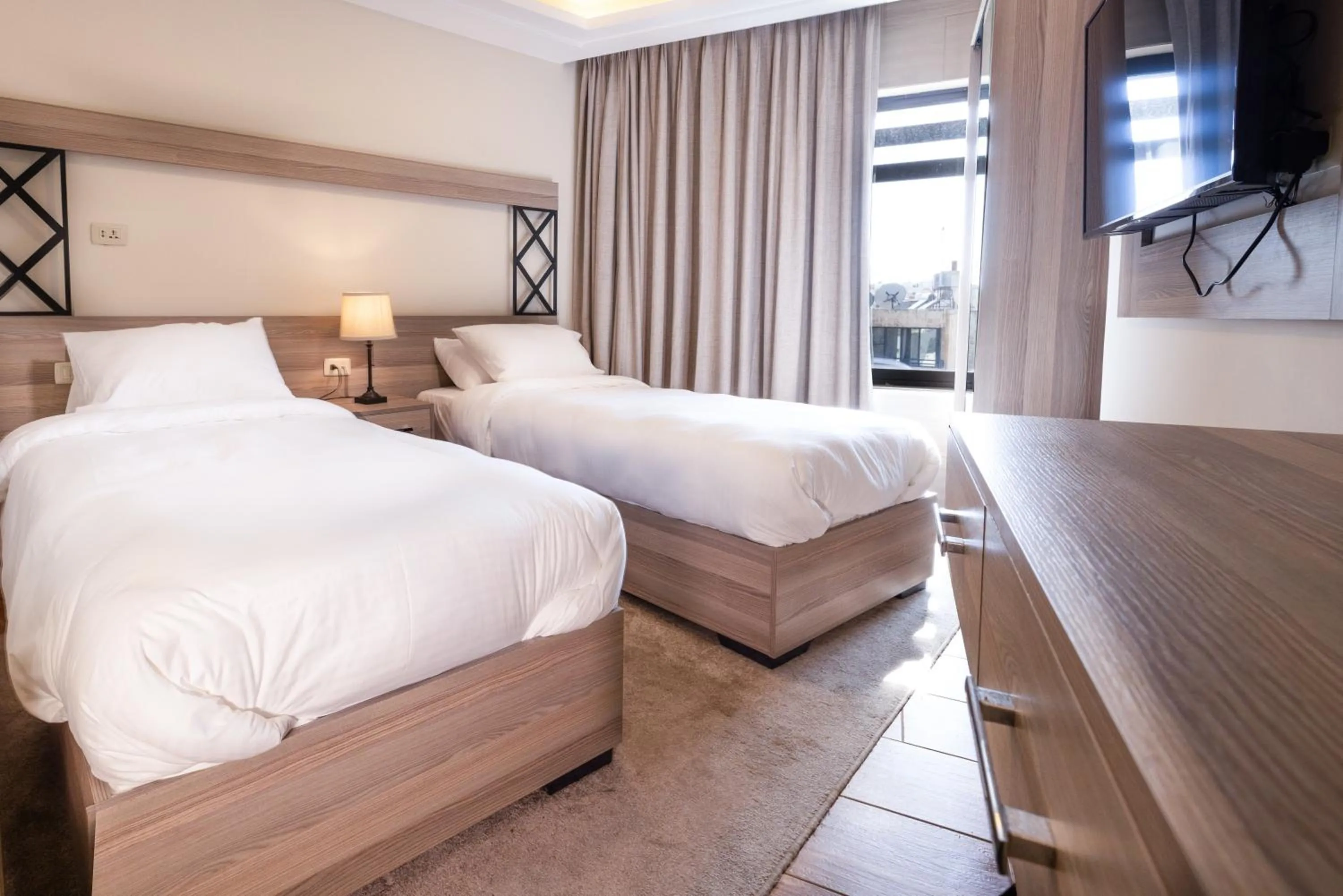 Bed in Sukoon Hotel Amman