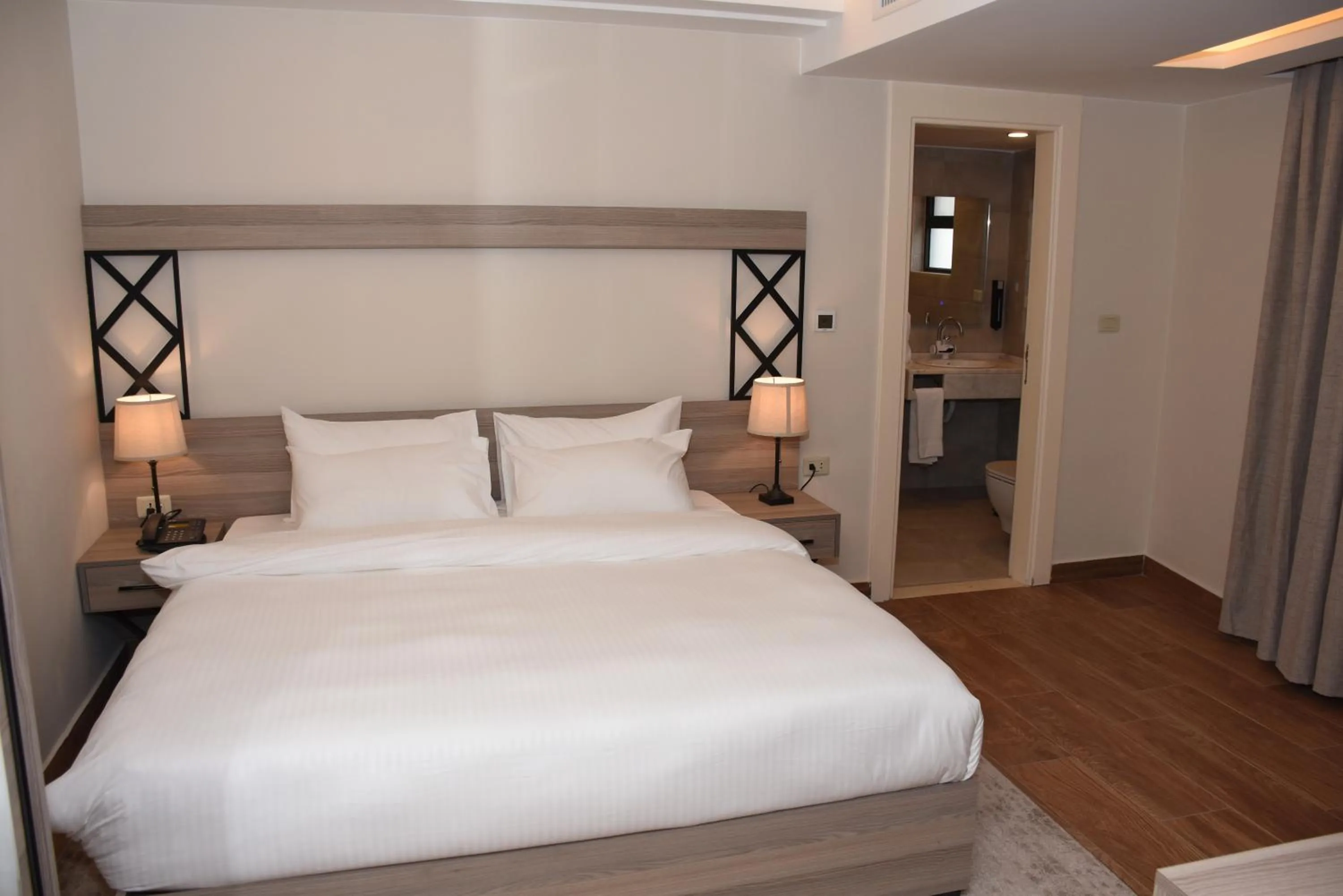 Bed in Sukoon Hotel Amman