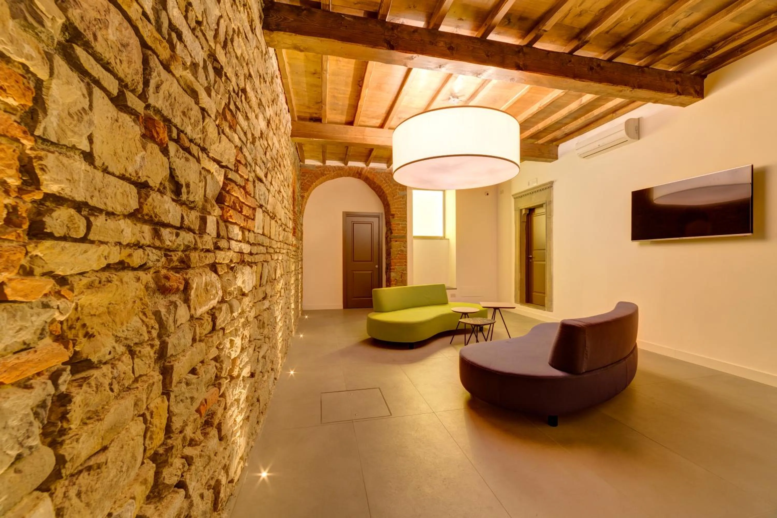 Communal lounge/ TV room in Palazzo Mannaioni Suites