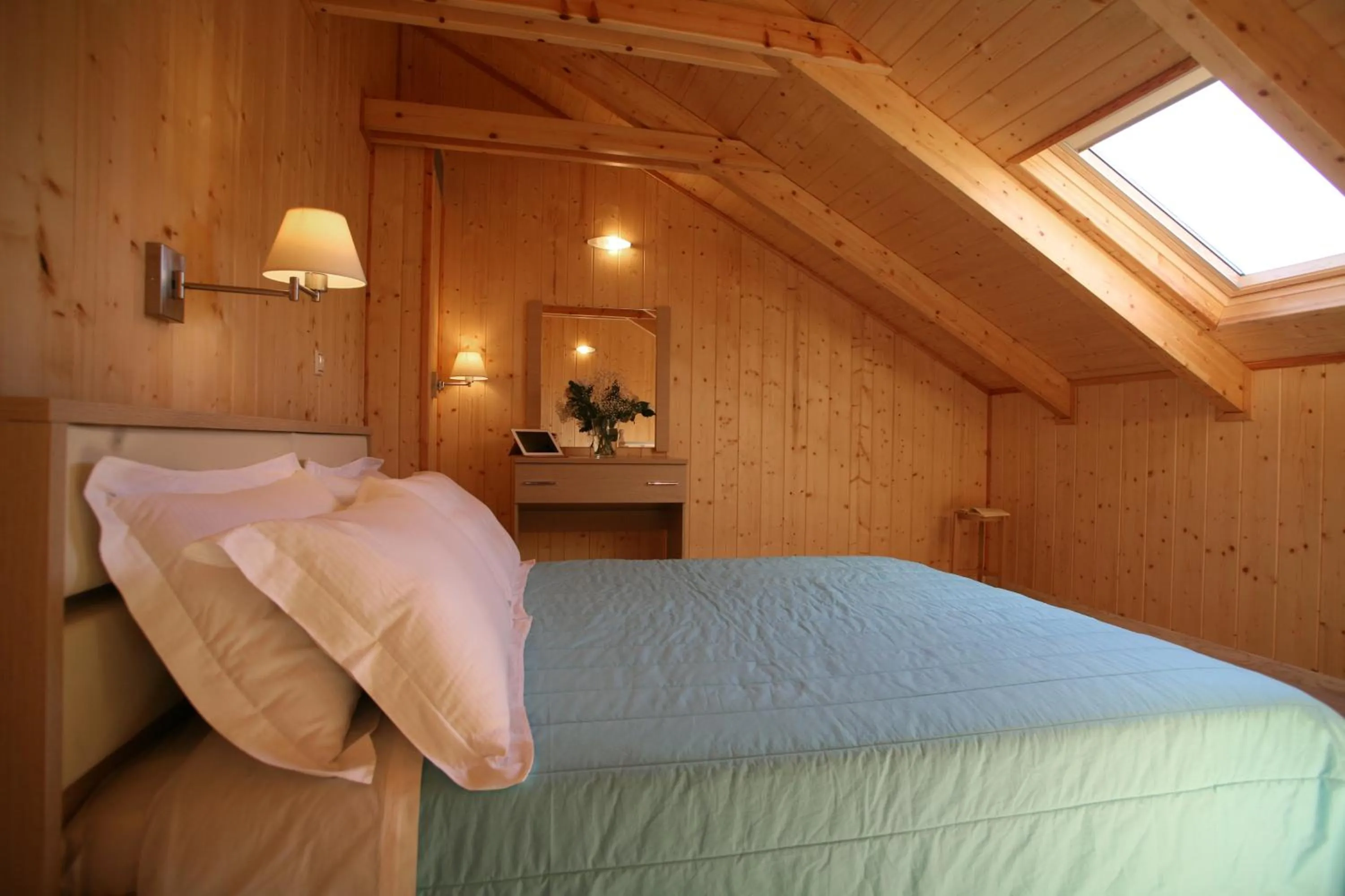 Bed in Grand TheoNi Boutique Hotel & Spa