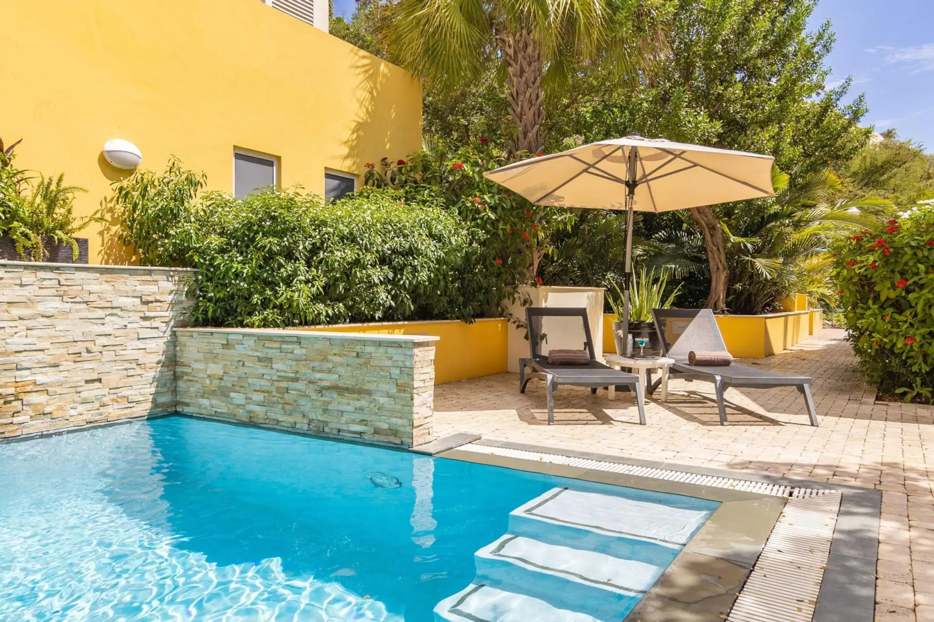 Swimming pool in Bayside Boutique Hotel - Blue Bay Golf & Beach Resort Swimming pool in Bayside Boutique Hotel - Blue Bay Golf & Beach Resort