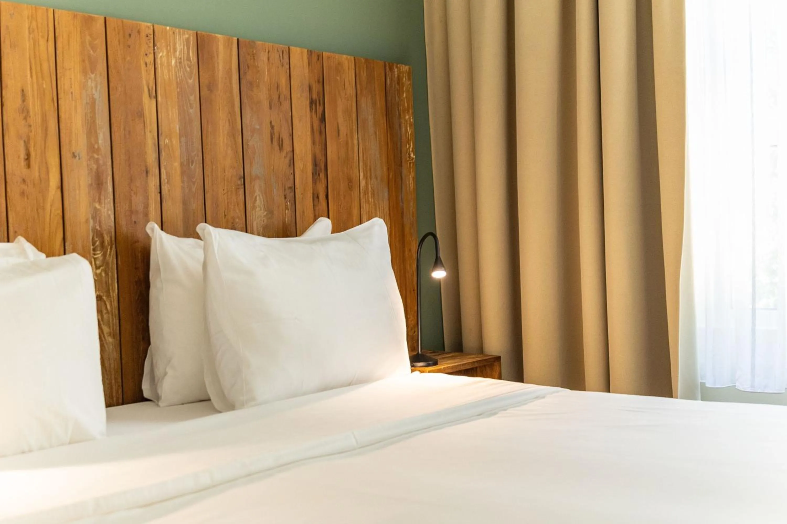 Bed in Bayside Boutique Hotel - Blue Bay Golf & Beach Resort