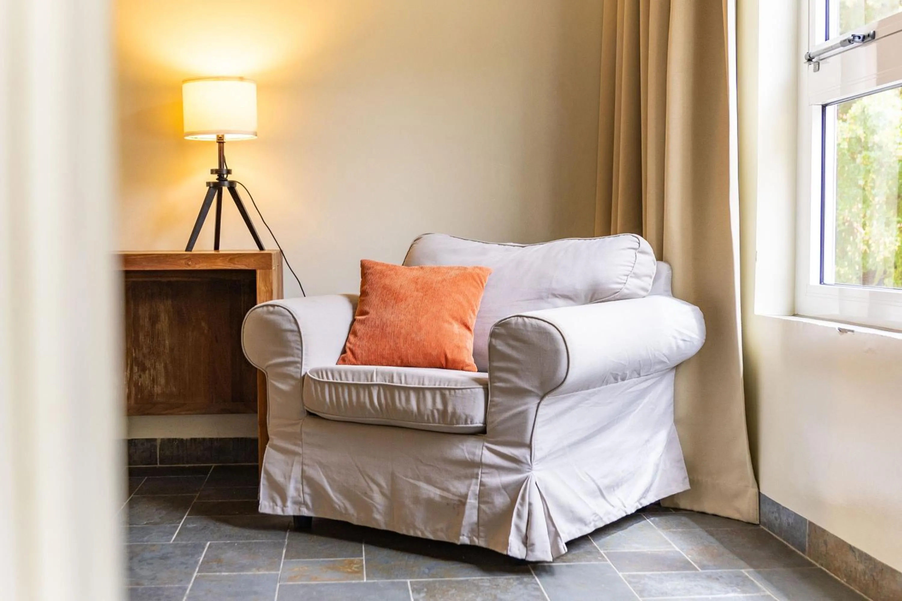 Seating area, Bed in Bayside Boutique Hotel - Blue Bay Golf & Beach Resort