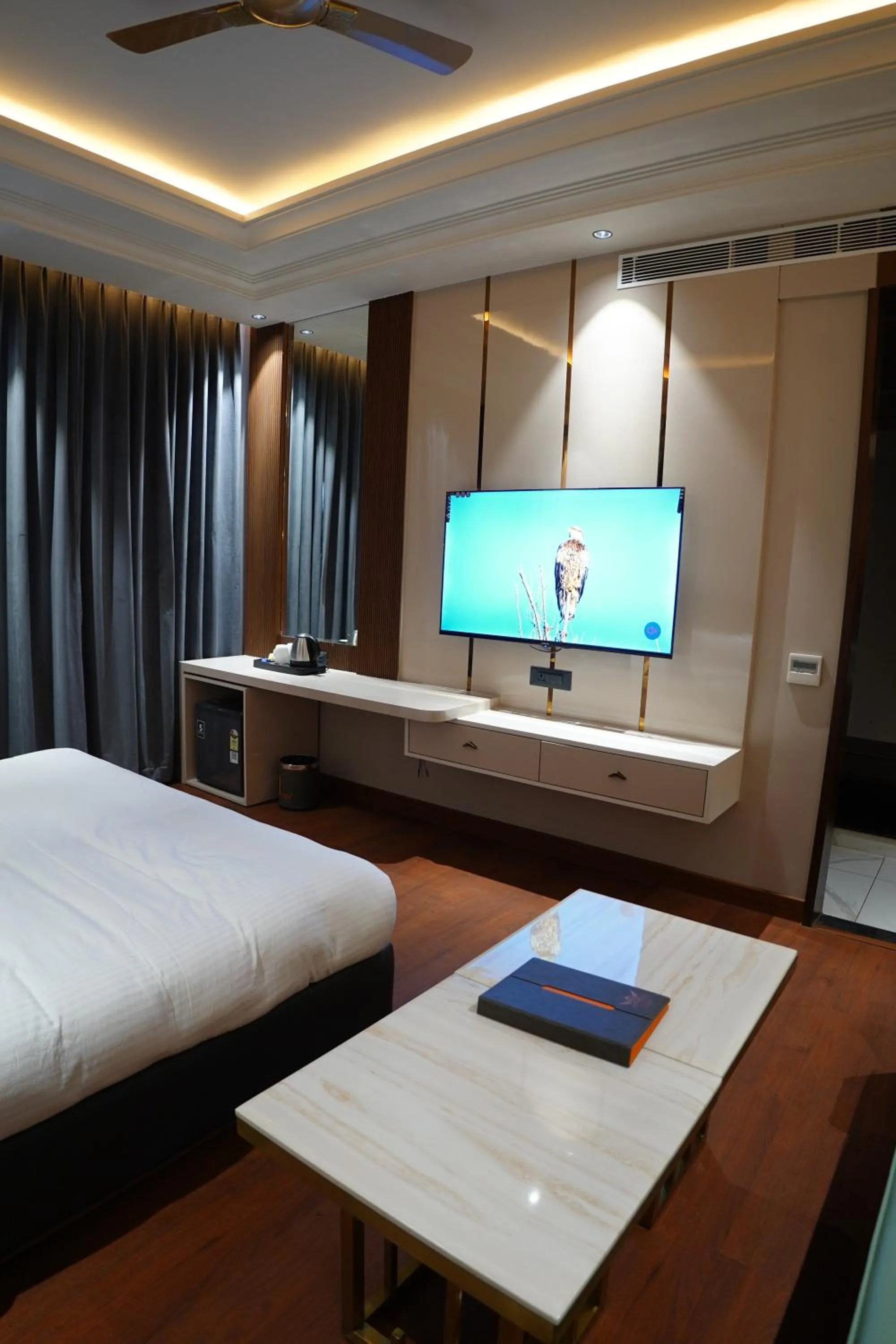 Bed in The Royal Velvet Hotel & Resort