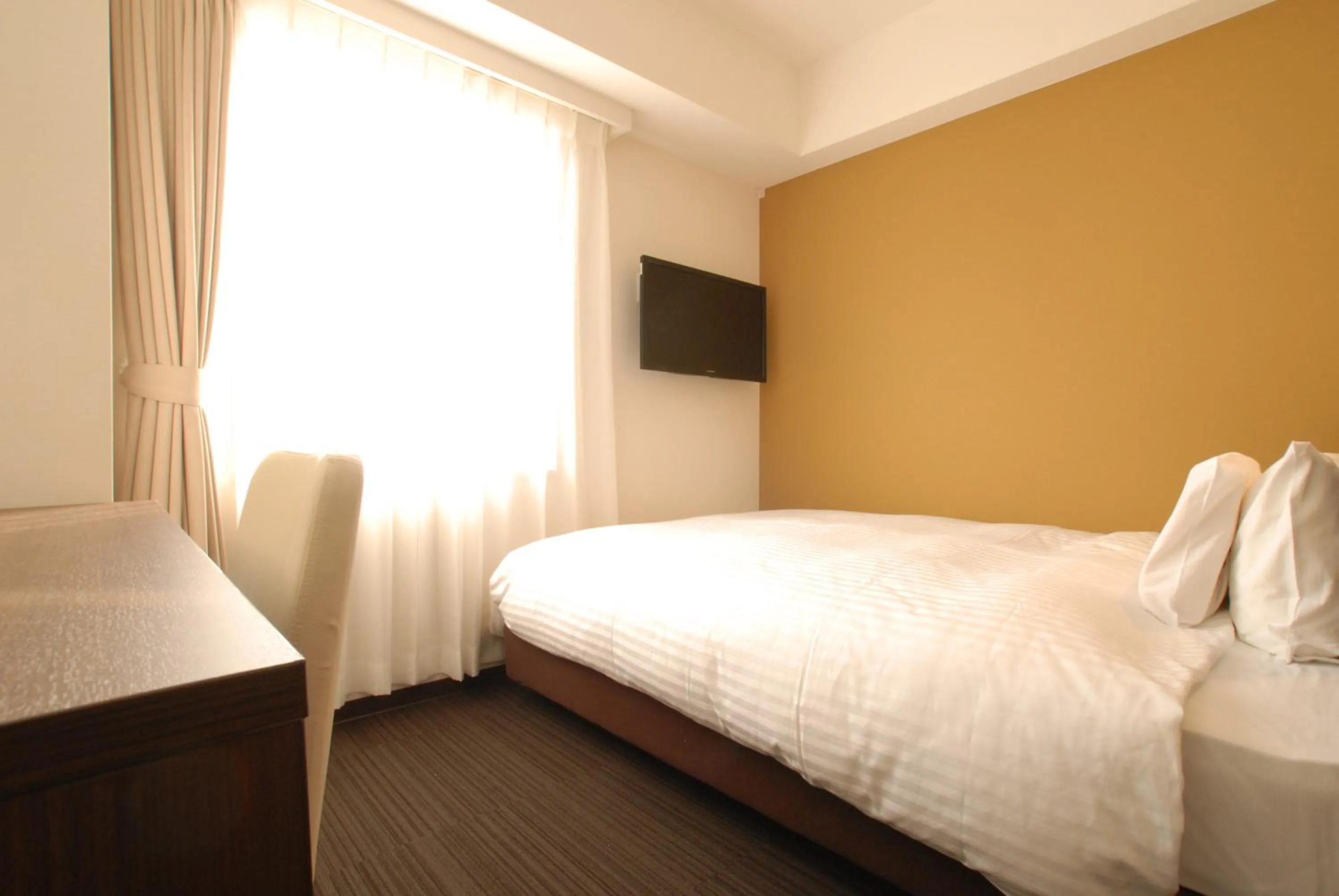 Bed in AB Hotel Kanazawa