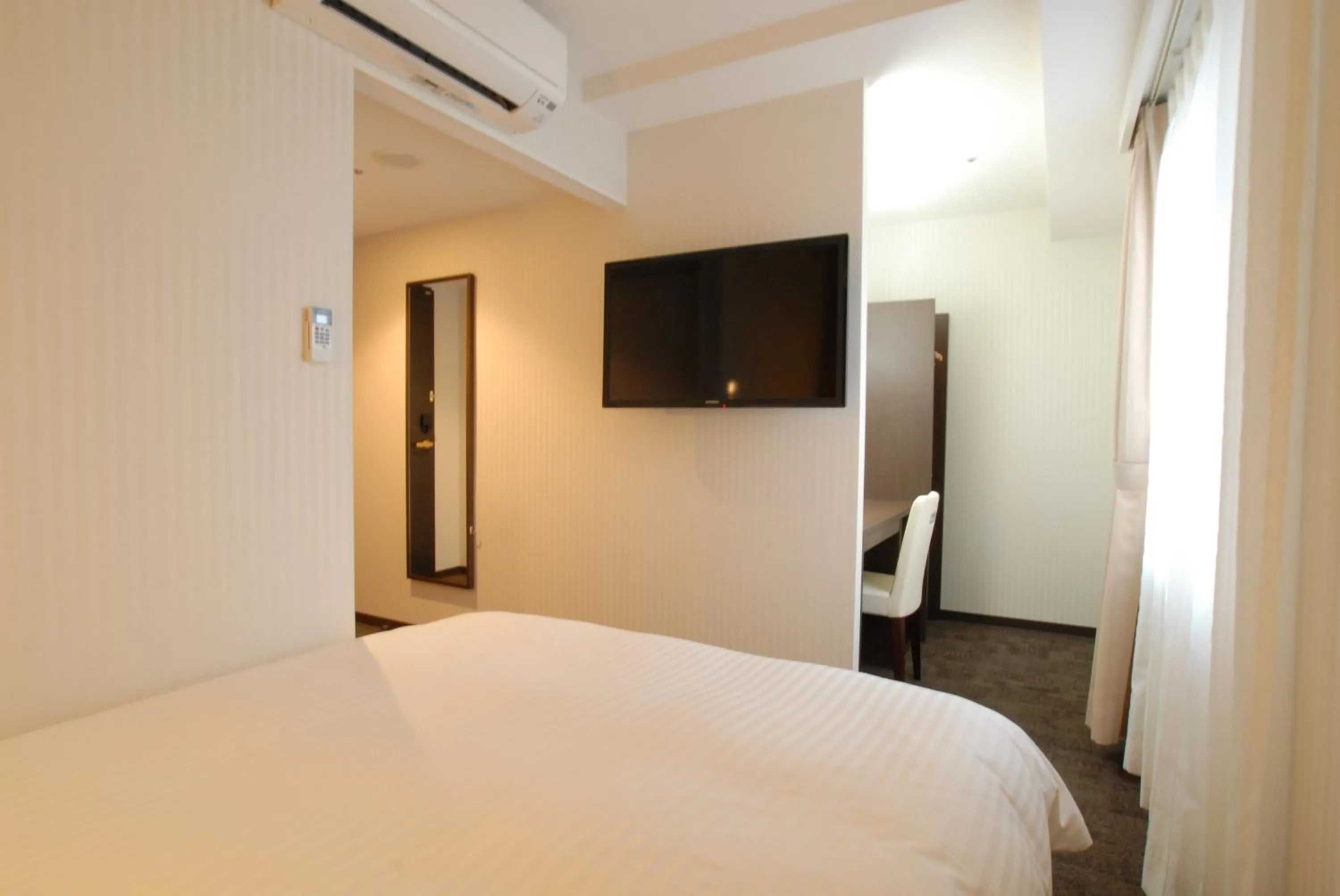 Bed in AB Hotel Kanazawa