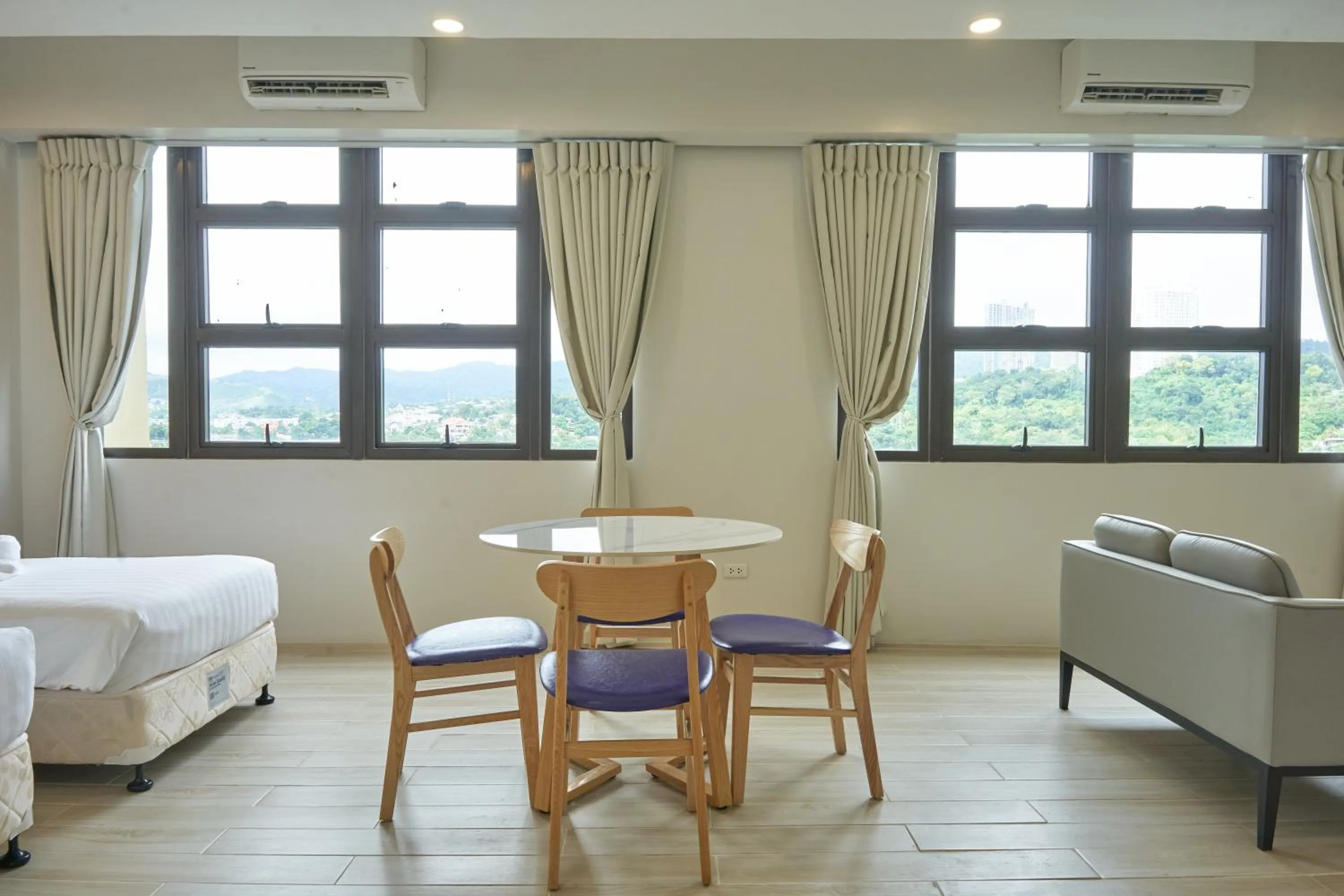 Dining area, Bed in Treewoods Residences
